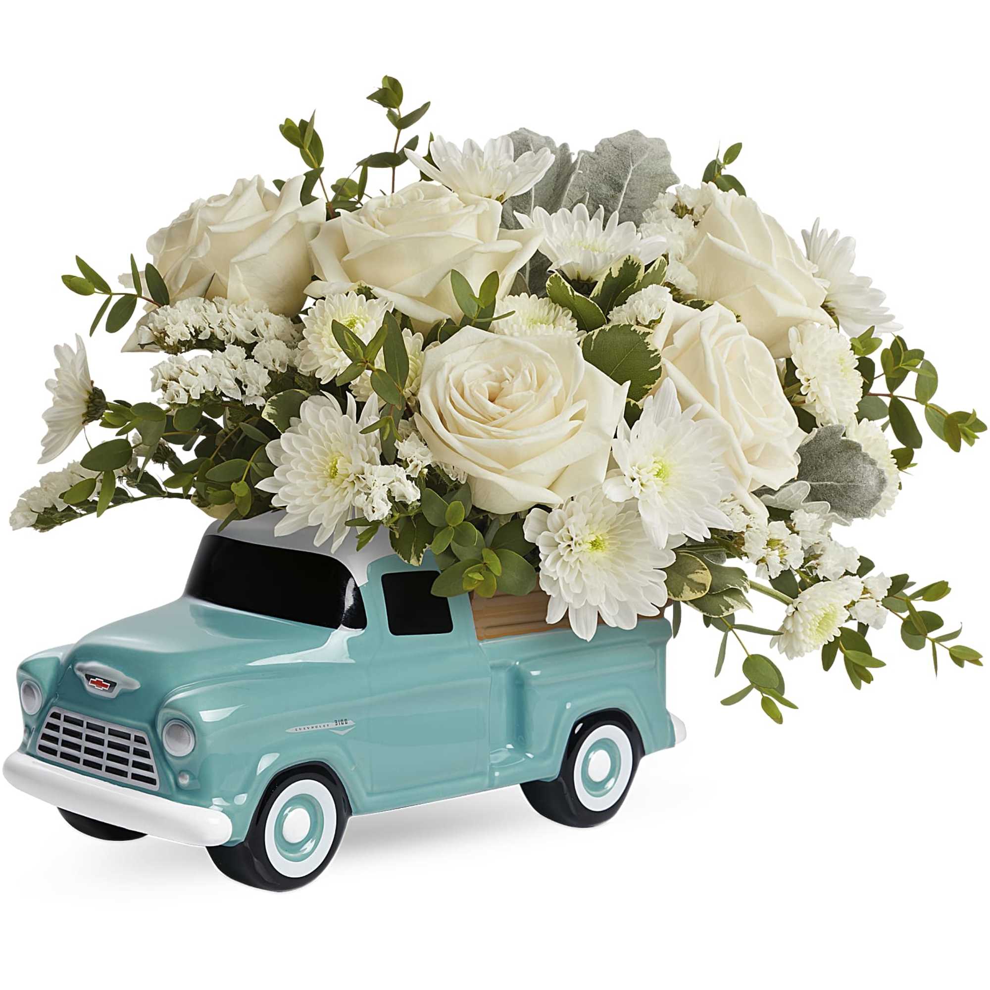 White roses and daisies arranged in a turquoise truck container