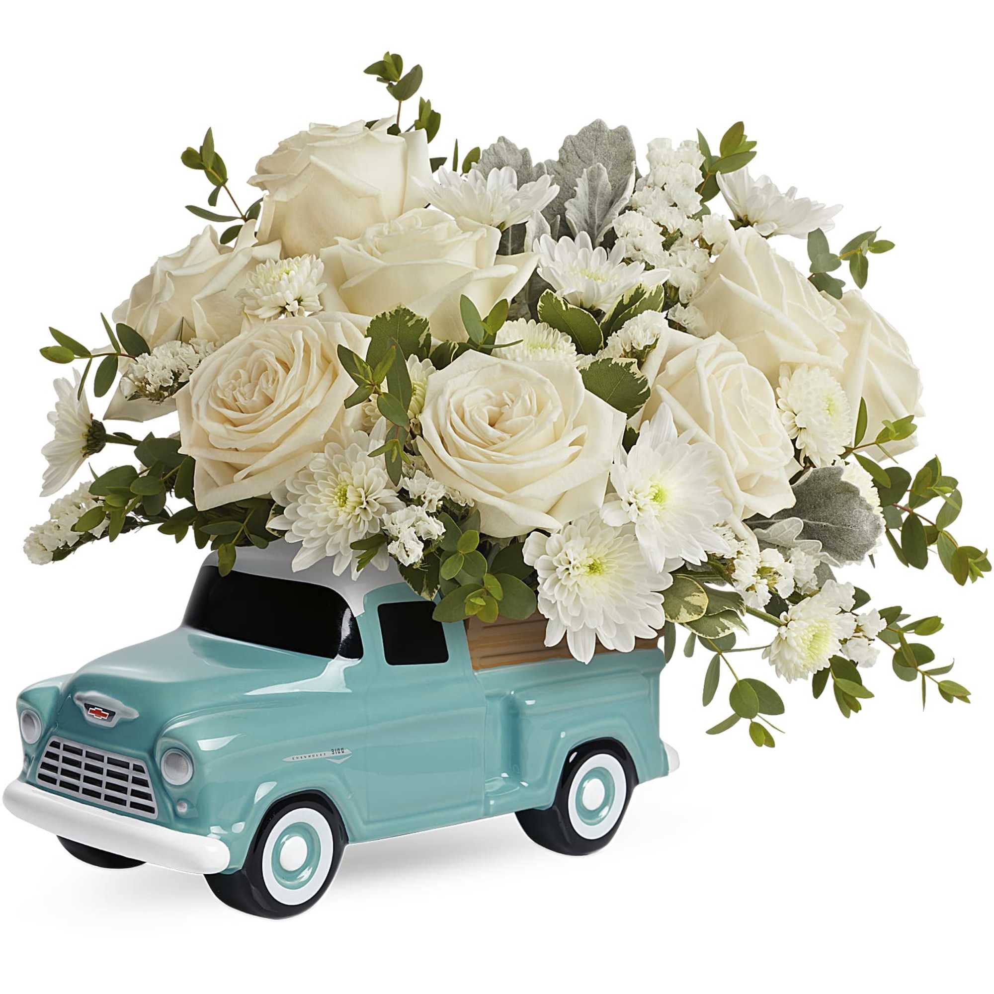 White rose arrangement in a turquoise truck-shaped vase
