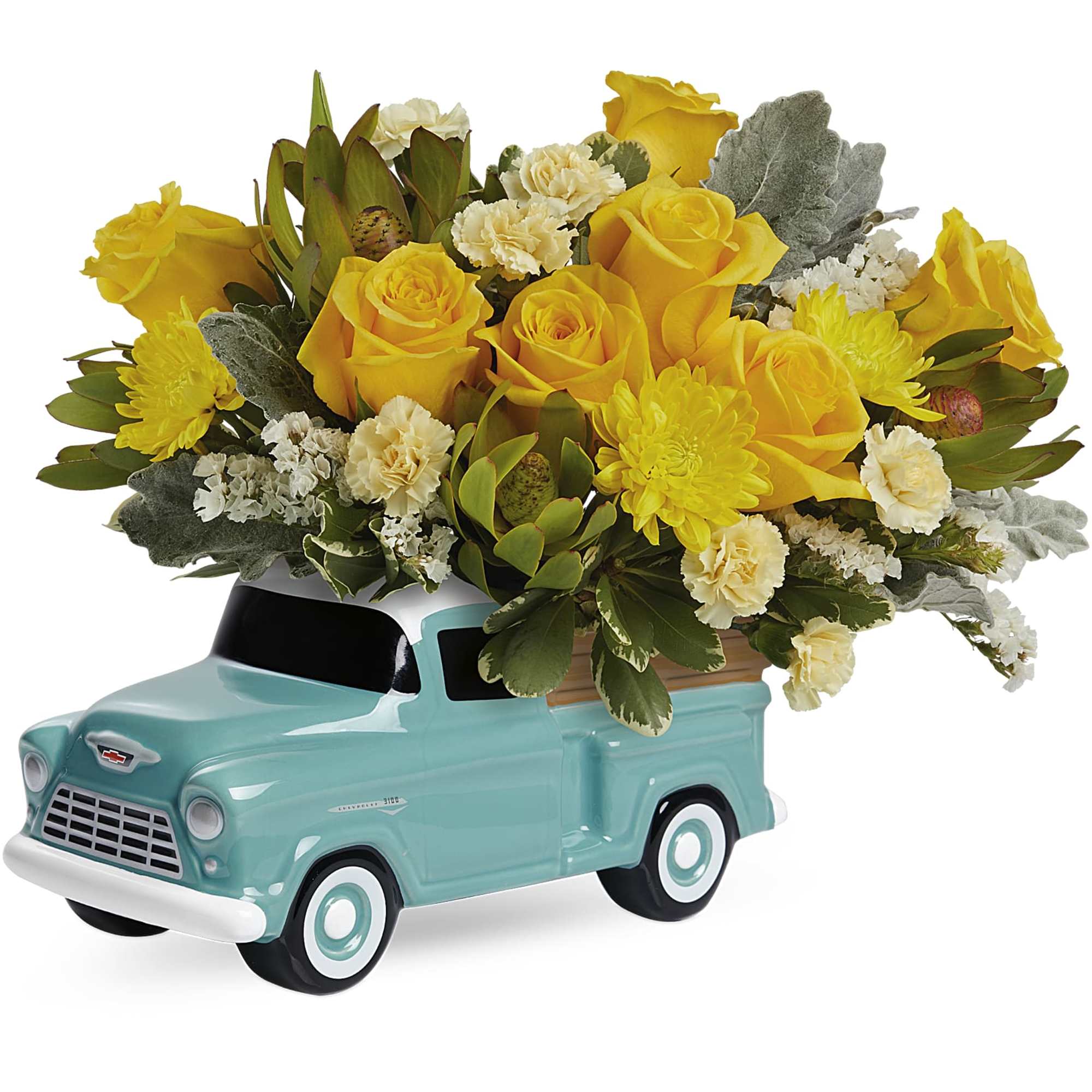 Yellow roses and cream flowers arranged in a turquoise ceramic truck