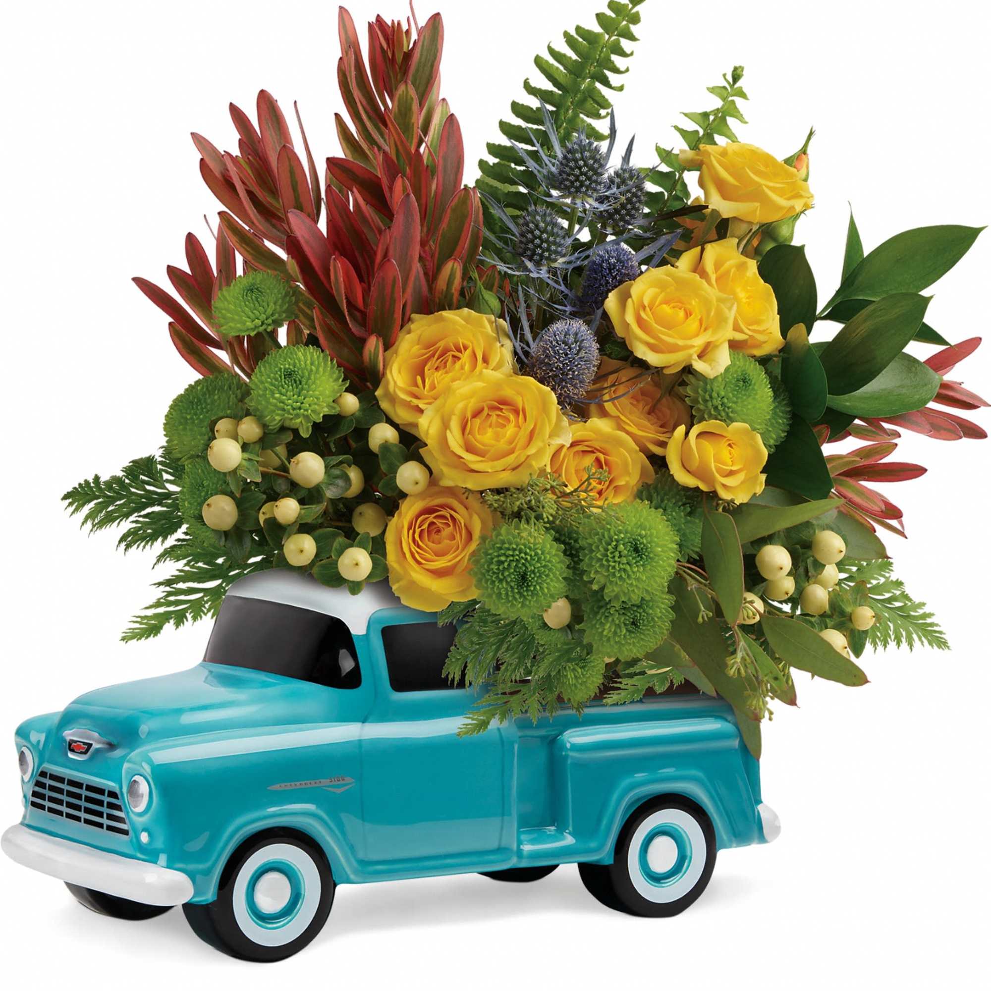 Yellow roses and green blooms arranged in a turquoise toy truck