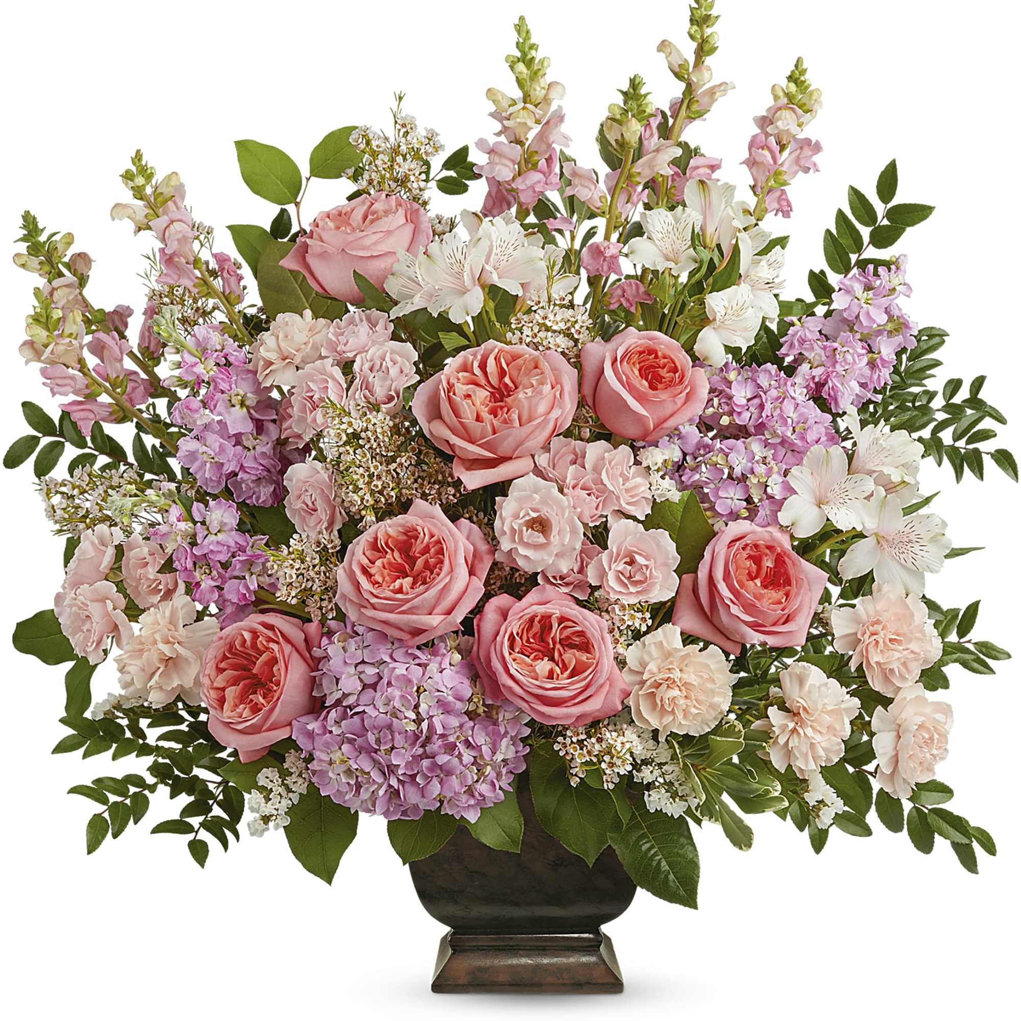 Pink roses and mixed pastel flowers arranged in a dark vase