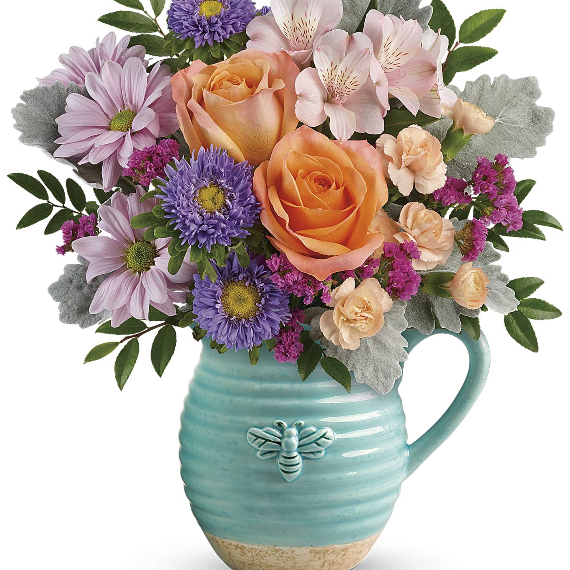 Bouquet of orange roses, pink daisies, and purple flowers in a turquoise mug vase