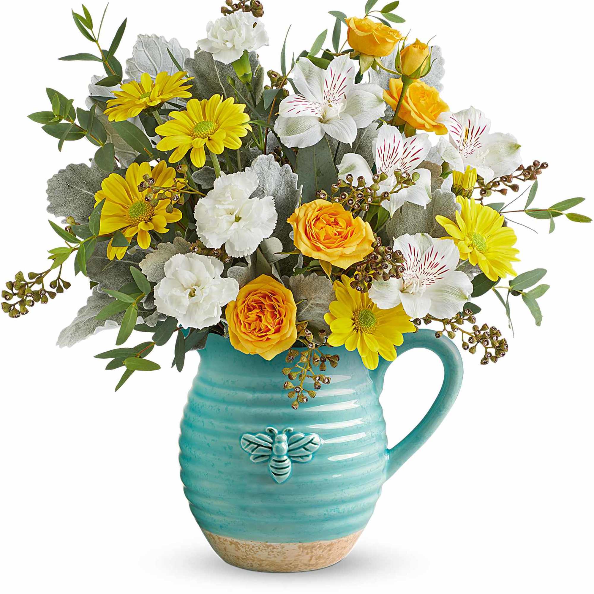 Yellow and white flowers arranged in a turquoise mug vase