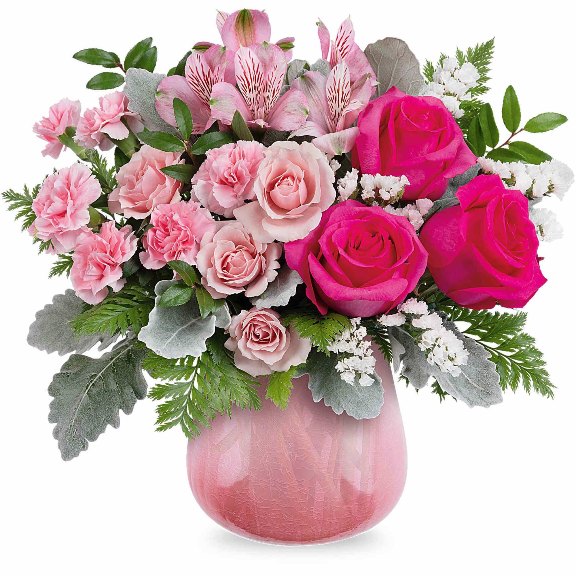 Pink roses and carnations in a pink glass vase
