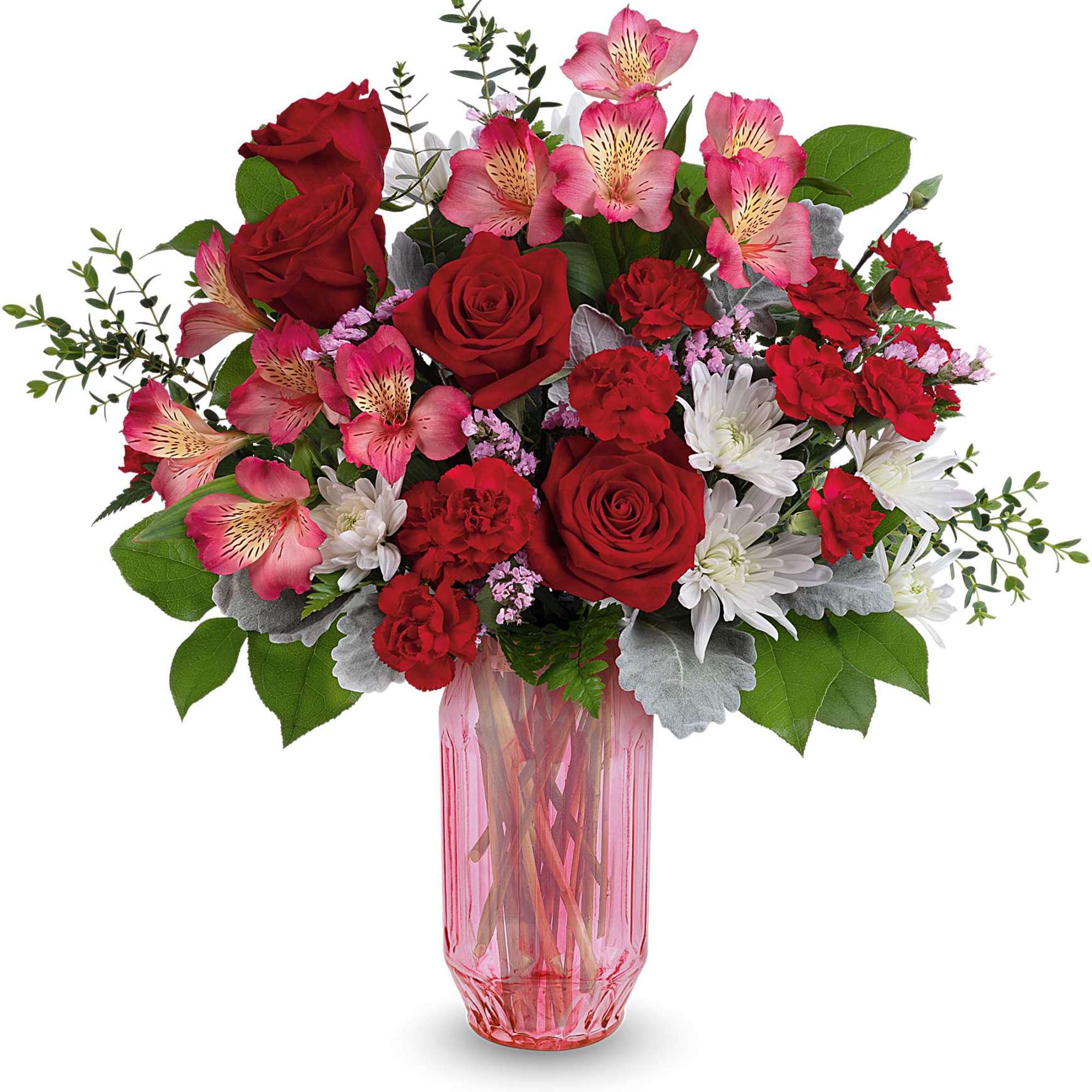 Red roses and pink alstroemeria in a pink glass vase