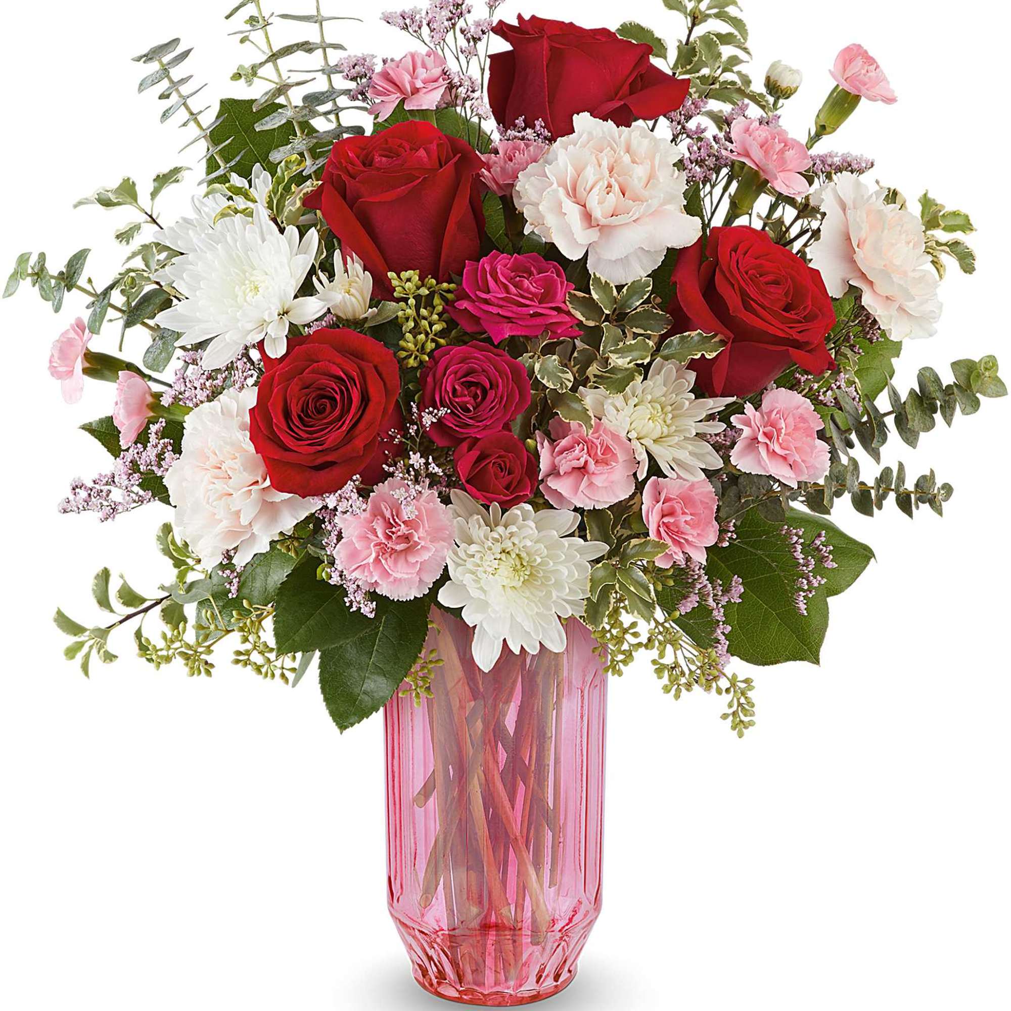 Mixed bouquet of red and pink roses in a pink glass vase