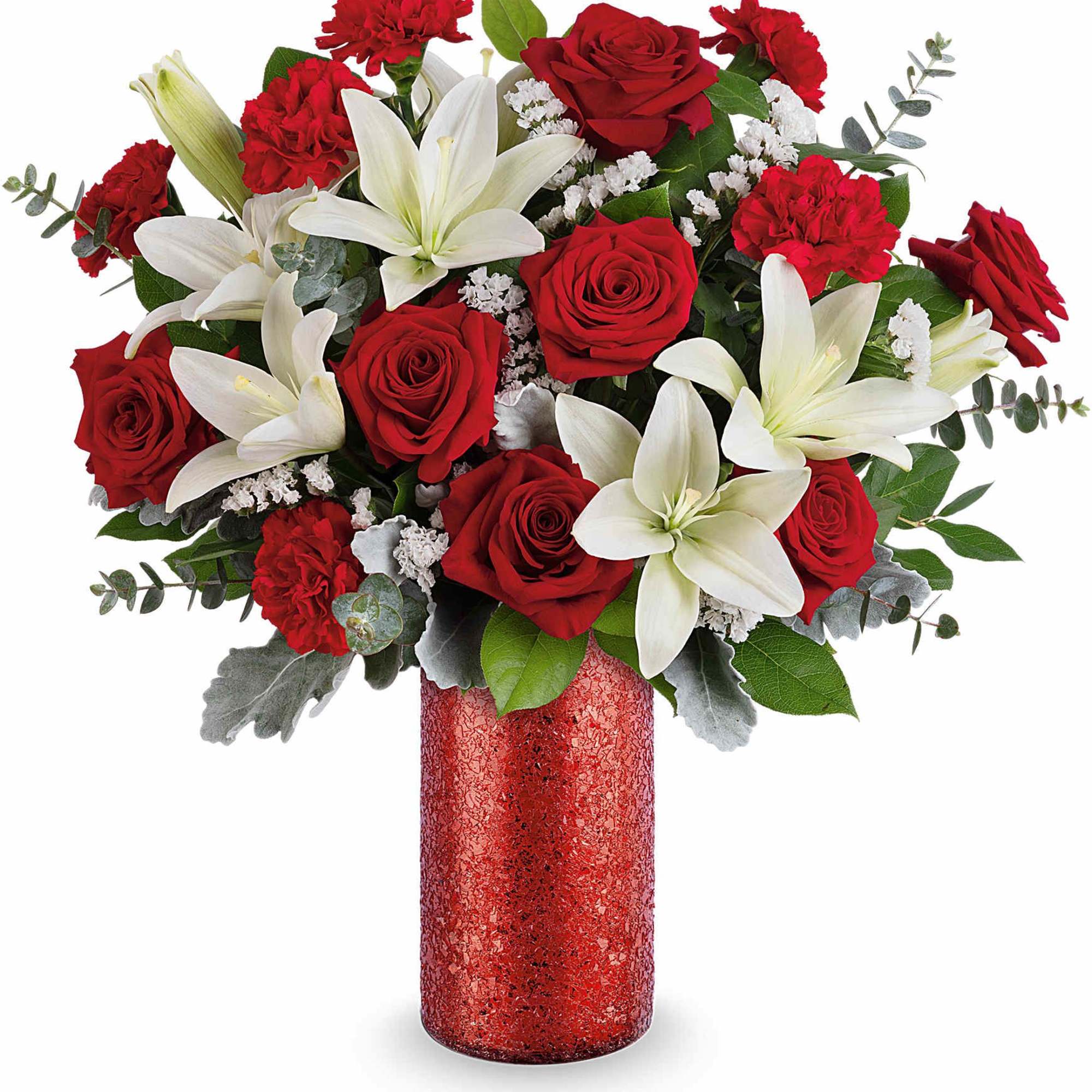 Red roses and white lilies in a red vase