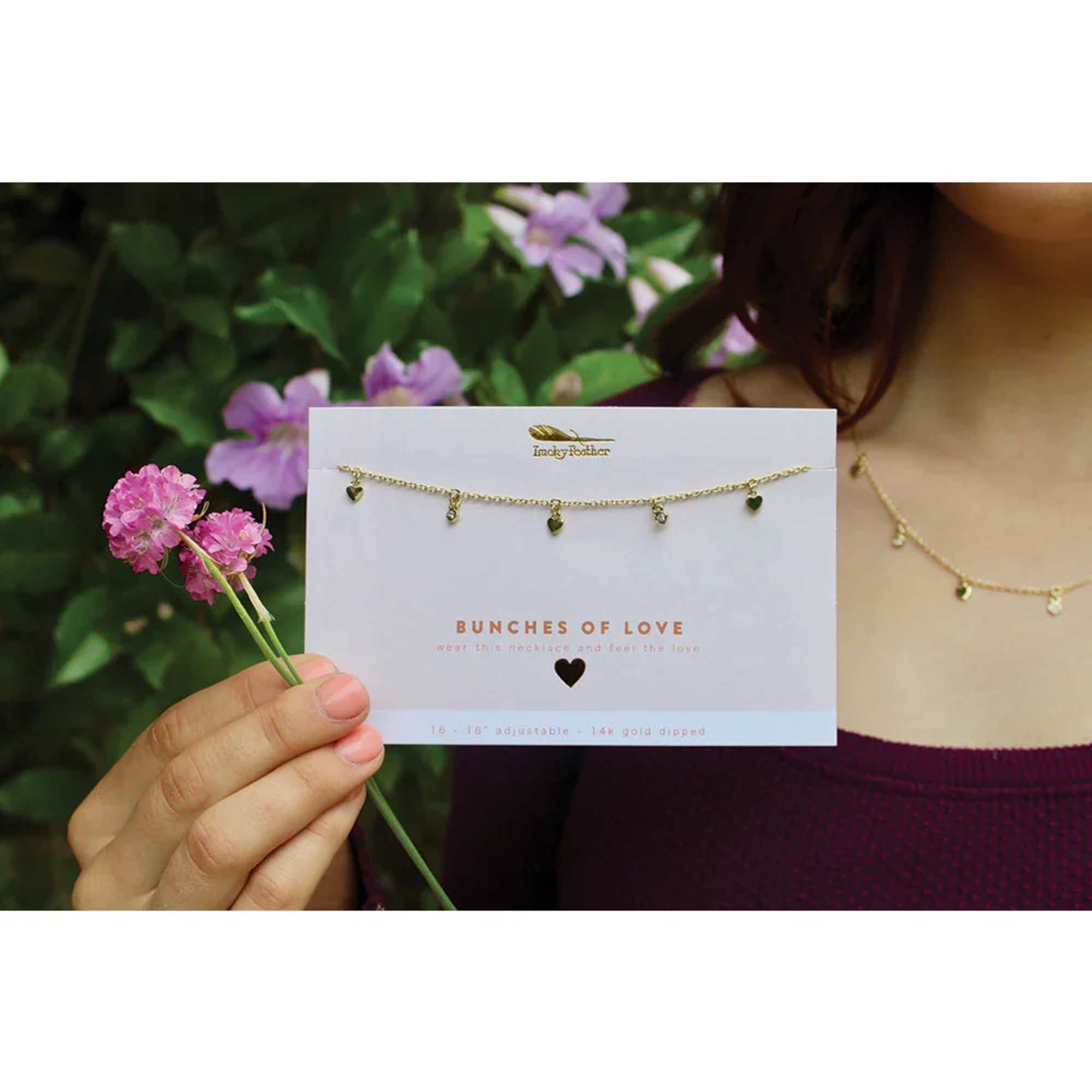 More is definitely merrier on this gold 'Bunches of Love' Dangle Necklace., photo 4 of 4