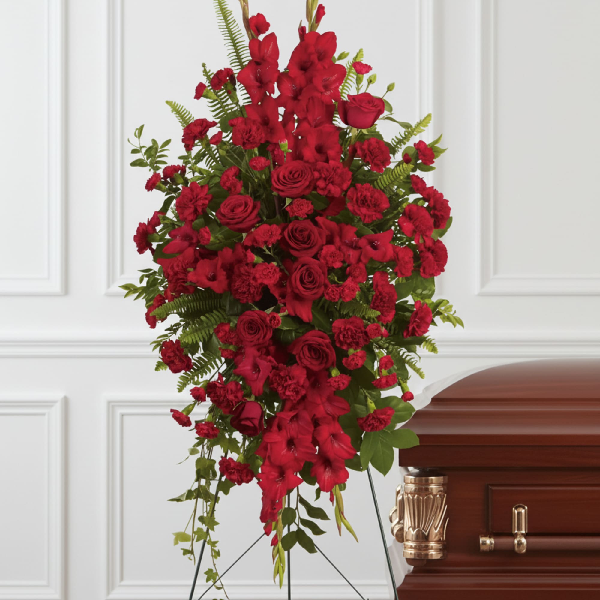 This rich, radiant spray of red roses, gladioli and other popular red
