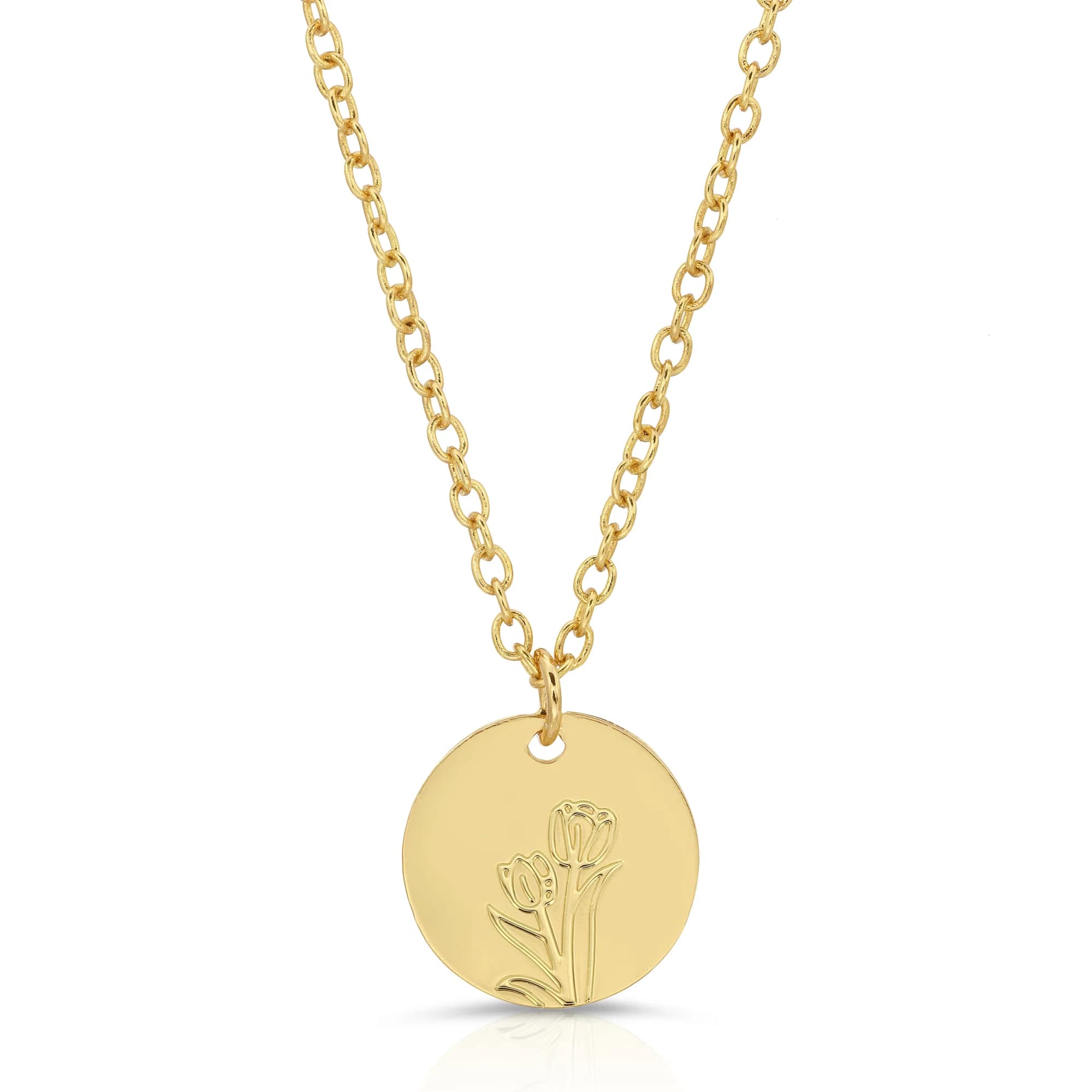 Gold necklace with a round pendant engraved with two small flowers.