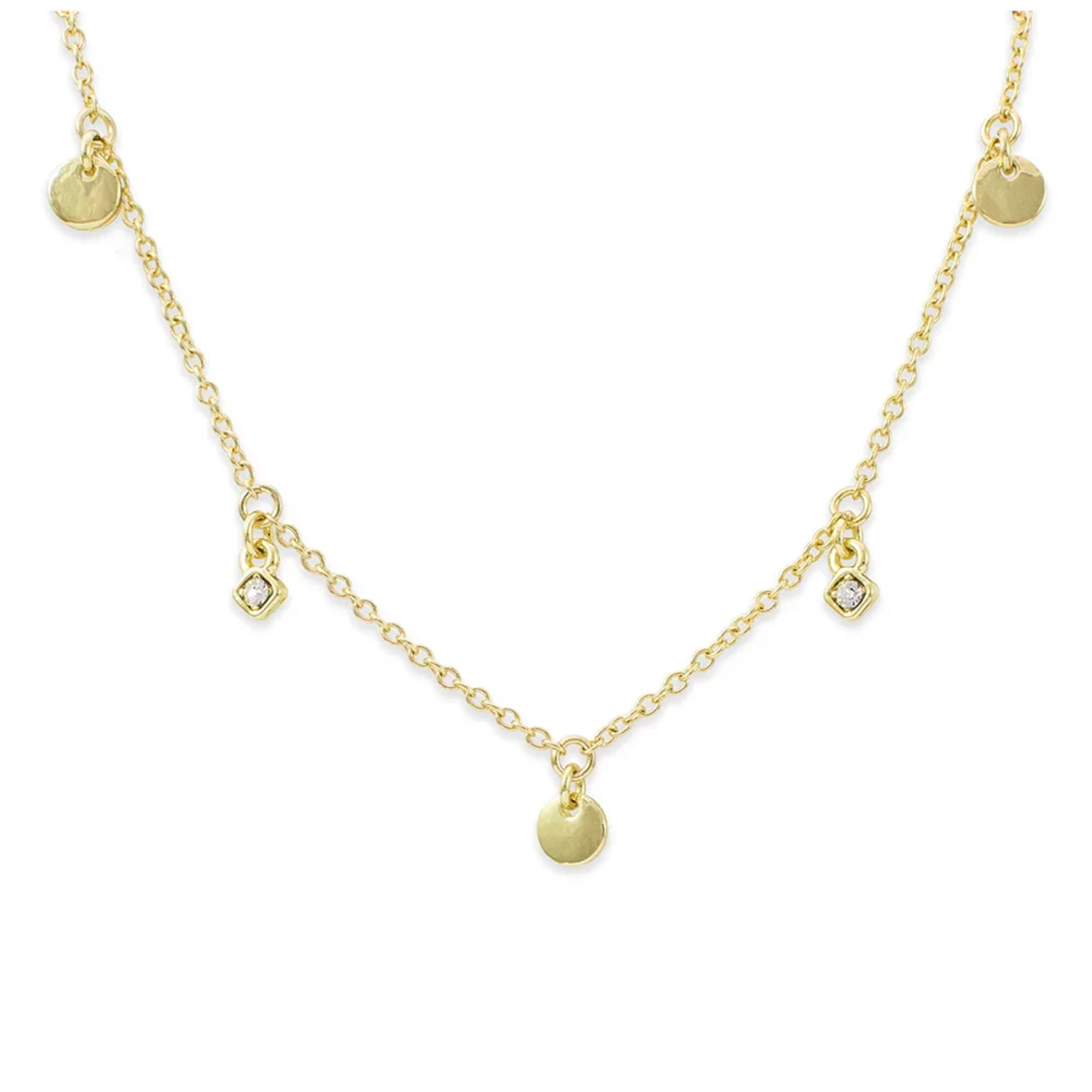 Delicate gold chain necklace with small round disc and tiny gemstone charms