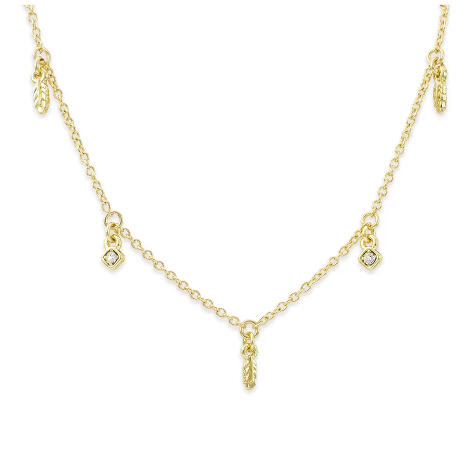 Delicate gold chain necklace with small feather and diamond-shaped charms