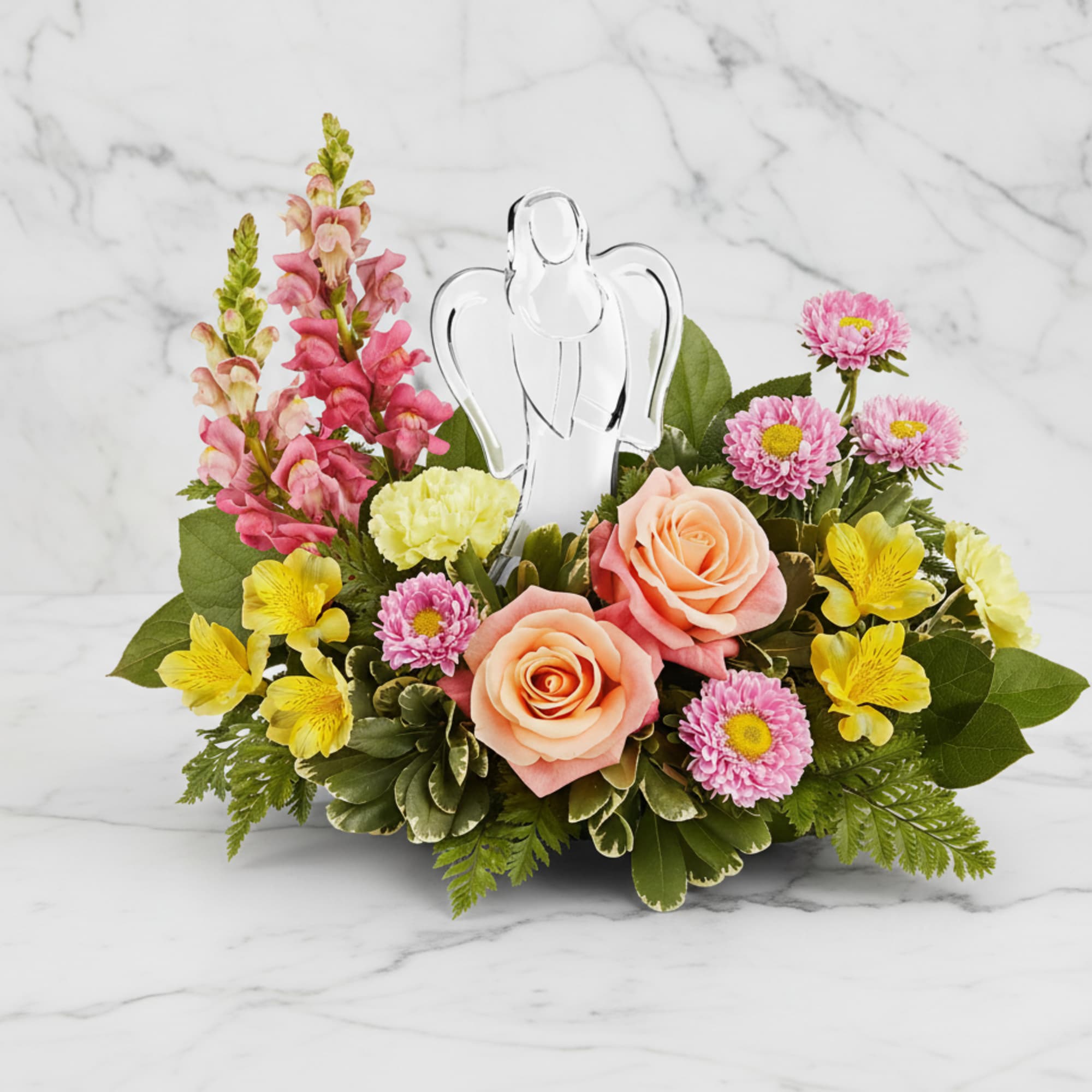 Radiating peace and comfort, our Angel's Embrace Bouquet surrounds a sparkling crystal