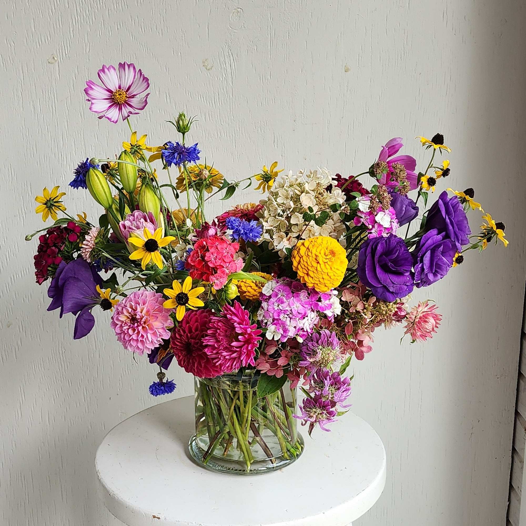 Colorful mixed bouquet in a clear glass vase