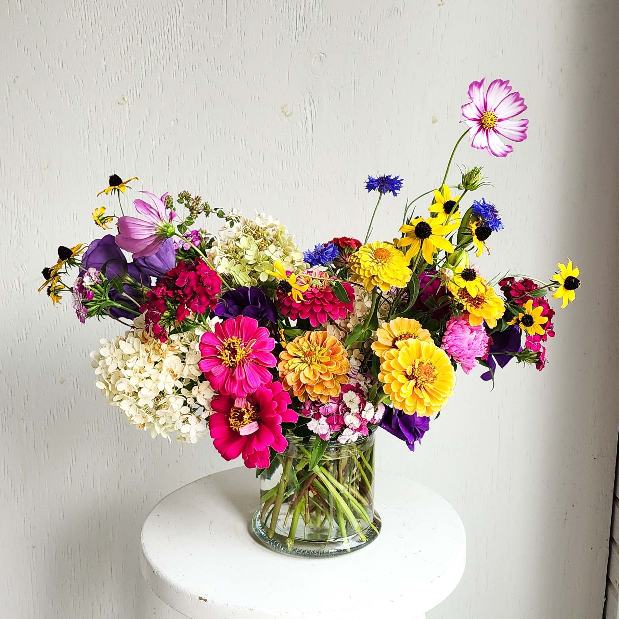 Colorful mixed bouquet in a clear glass vase