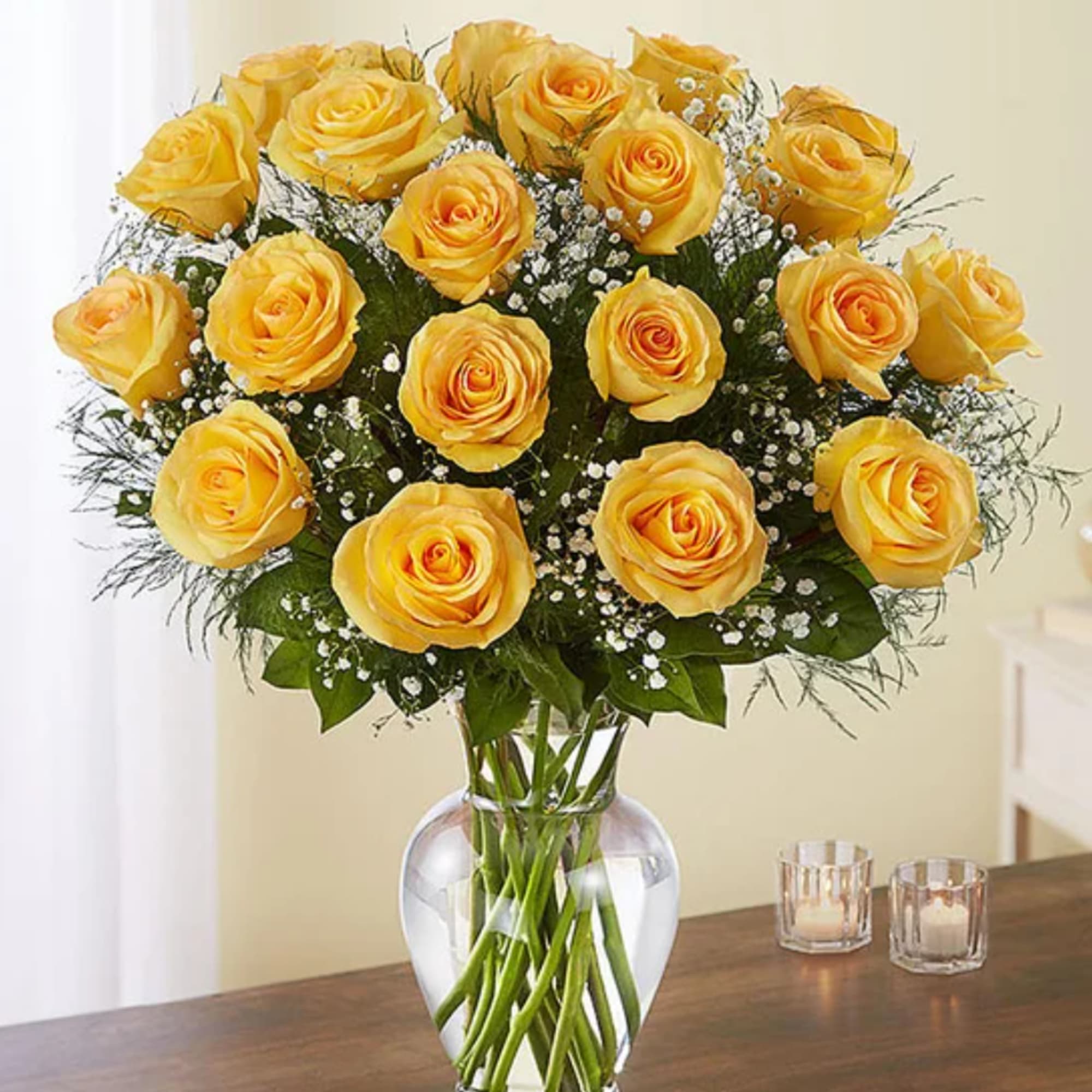 Yellow roses arranged in a clear glass vase