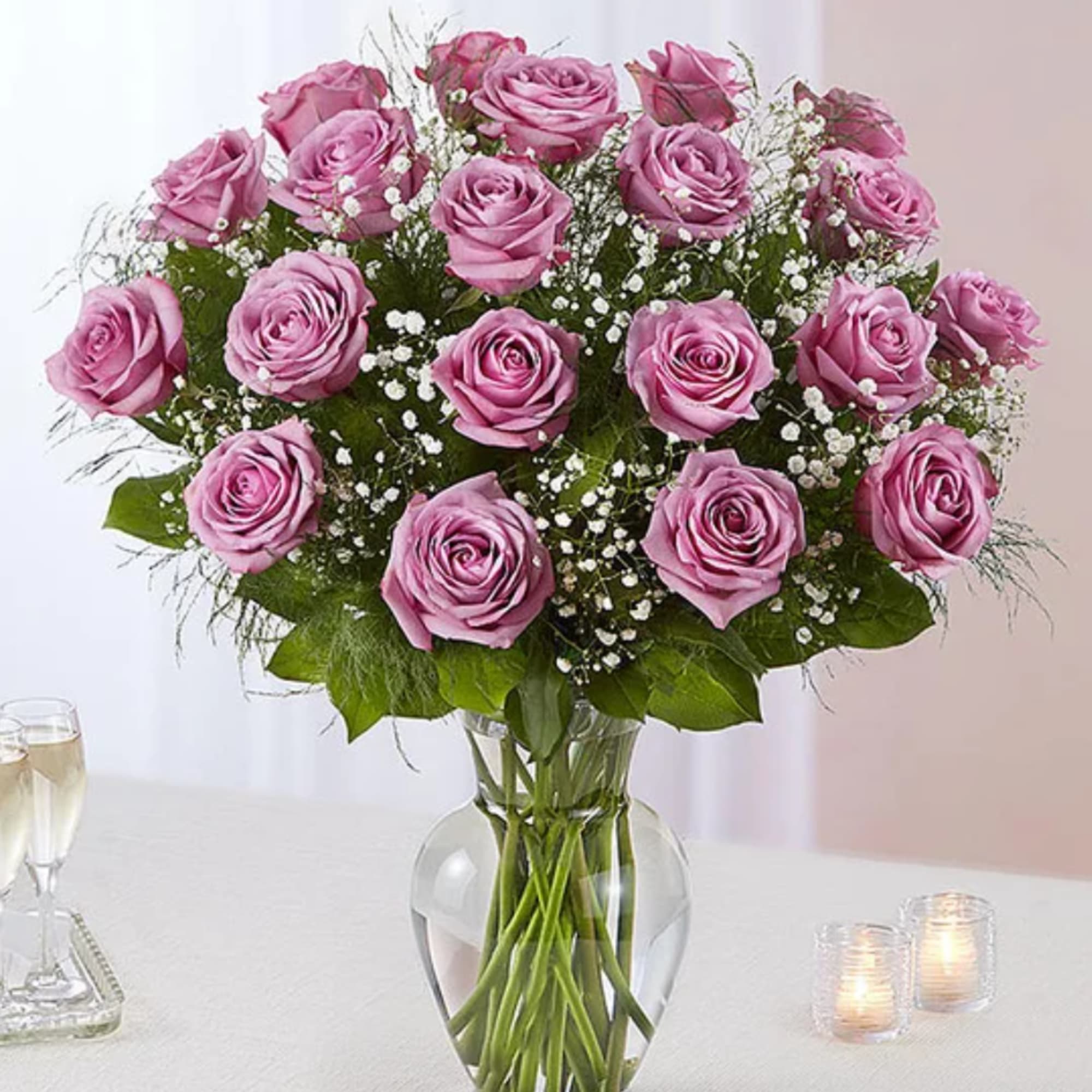 Pink roses arranged in a clear glass vase