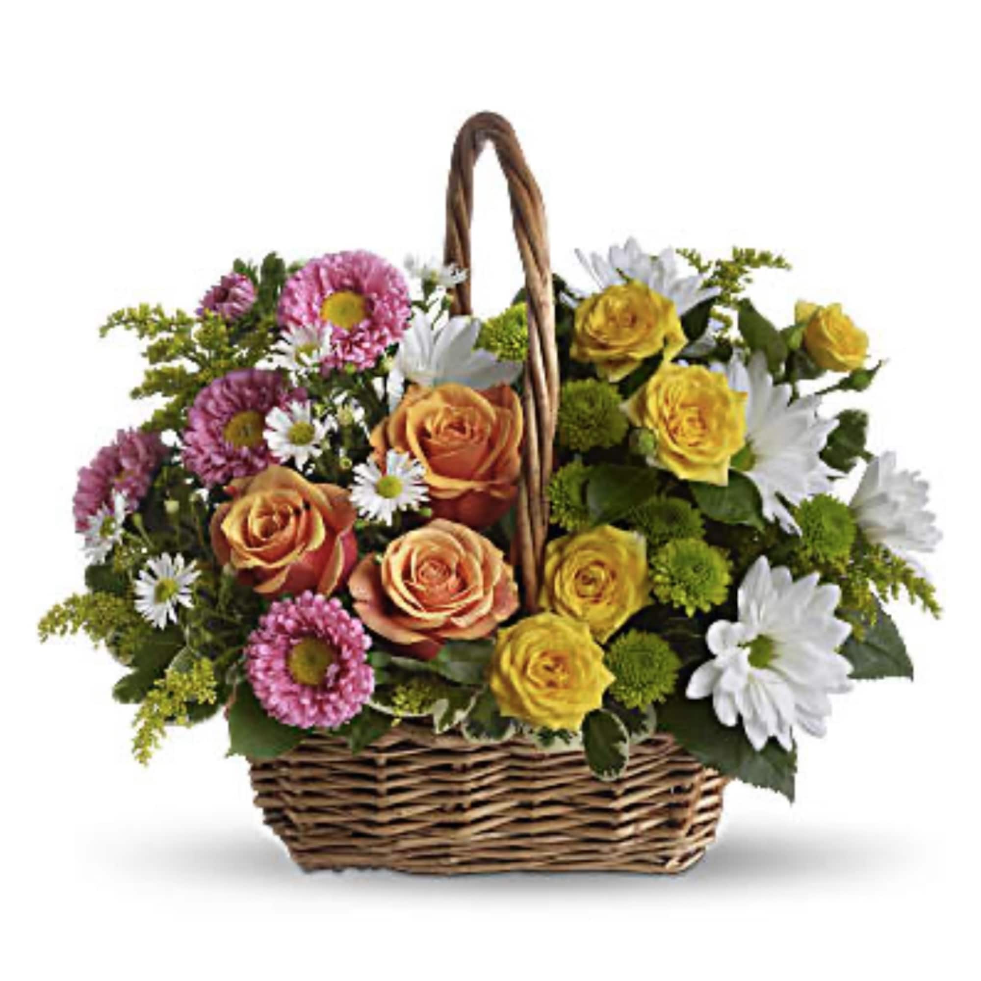 Basket of mixed roses and daisies in pink, yellow, orange, and white