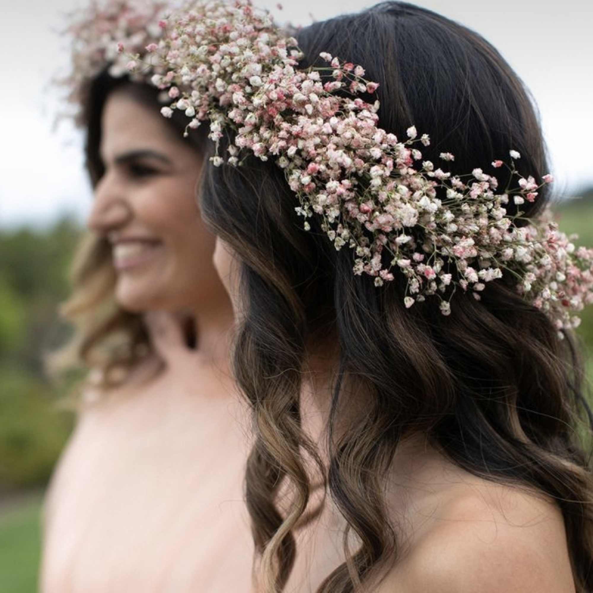 Woman wearing a pink baby's breath flower crown