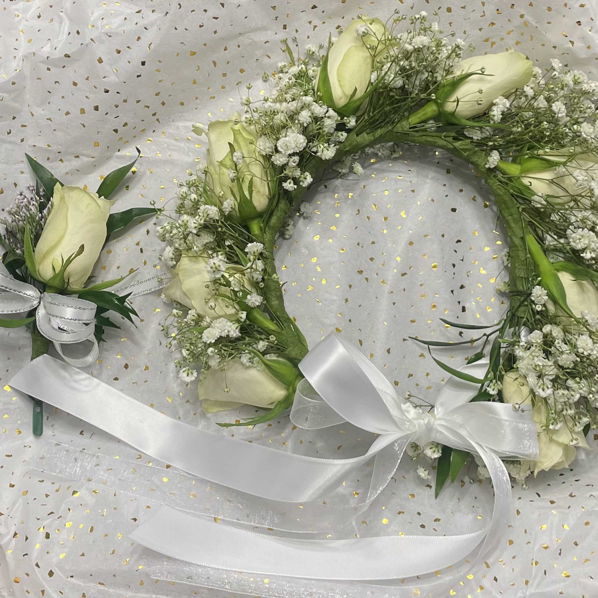 White rose floral wreath with baby's breath and white ribbon