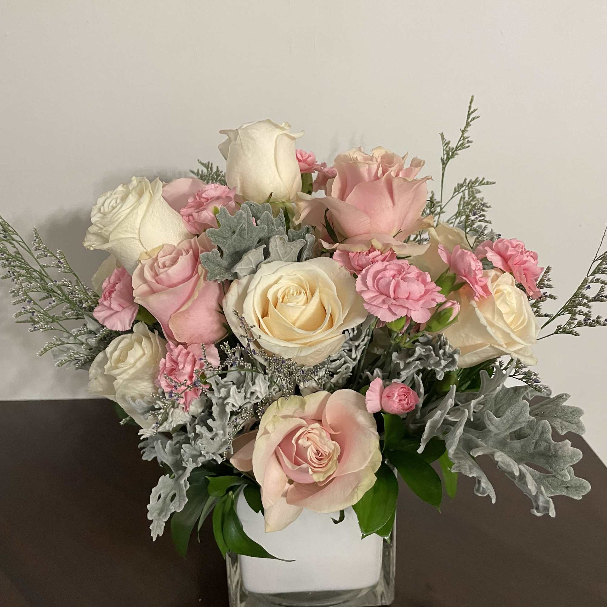 This angelic arrangement is as cute as it is pretty. Featuring the