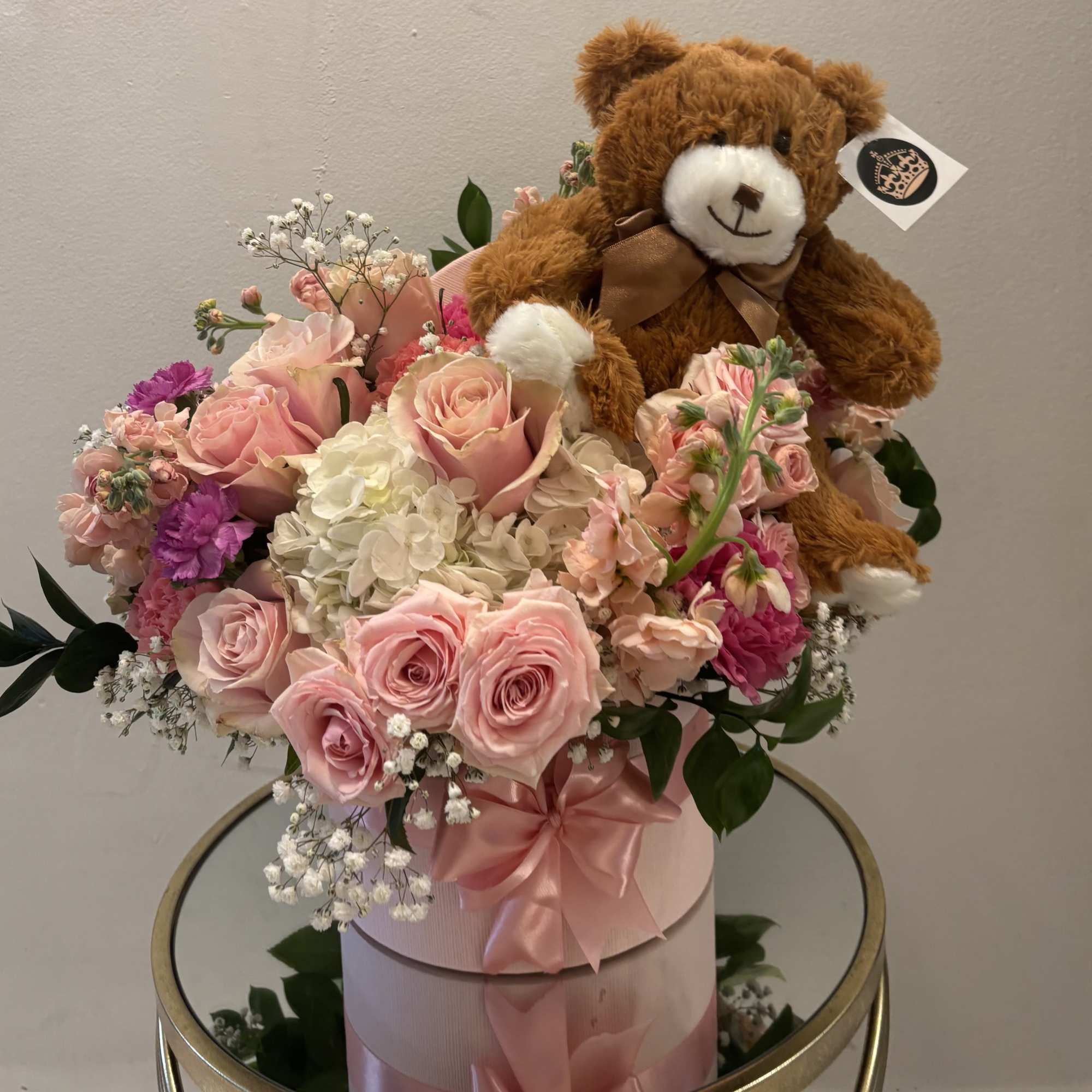 Pink rose bouquet with a teddy bear topper in a pink hatbox