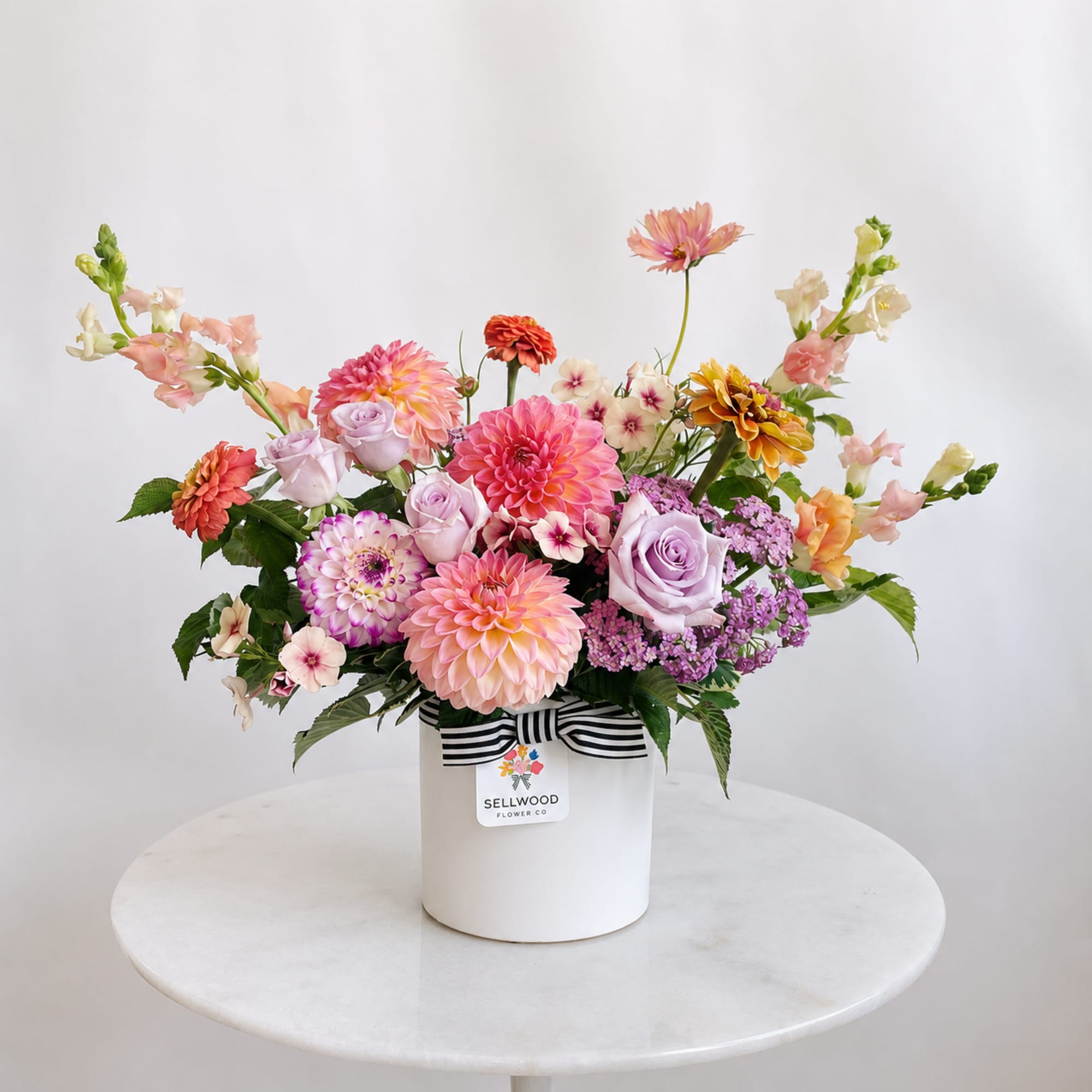 A cheery mix of garden-fresh local flowers such as dahlias, zinnias, snapdragons
