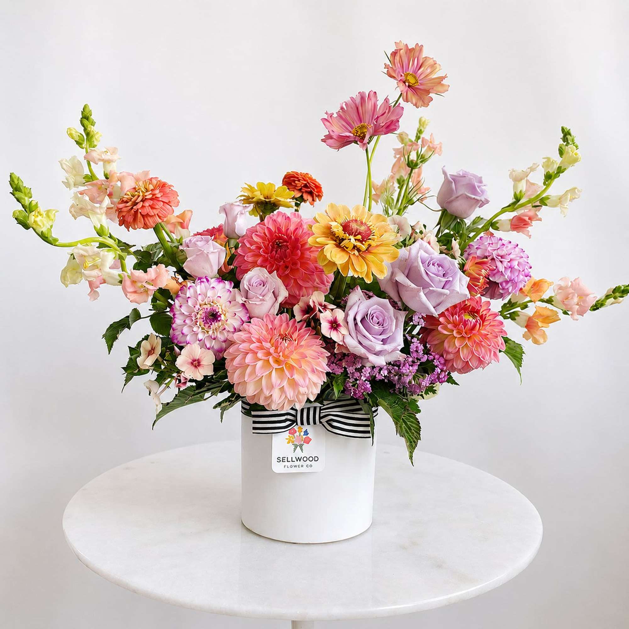 A cheery mix of garden-fresh local flowers such as dahlias, zinnias, snapdragons