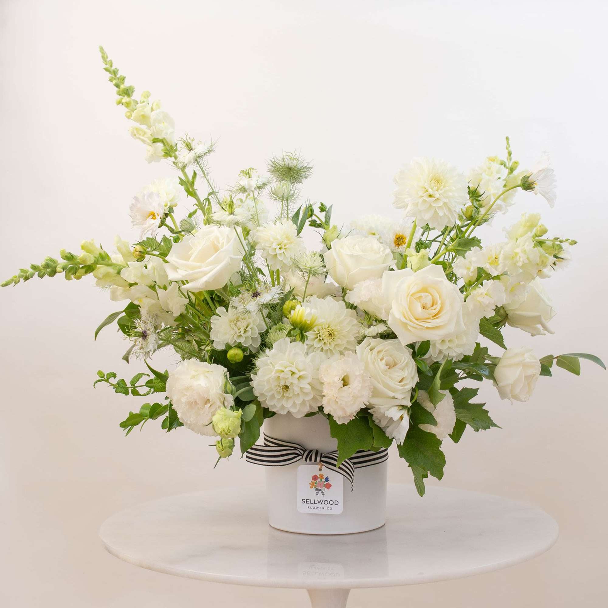 Beautiful and simply elegant arrangement of all white (mostly local!) blooms. 