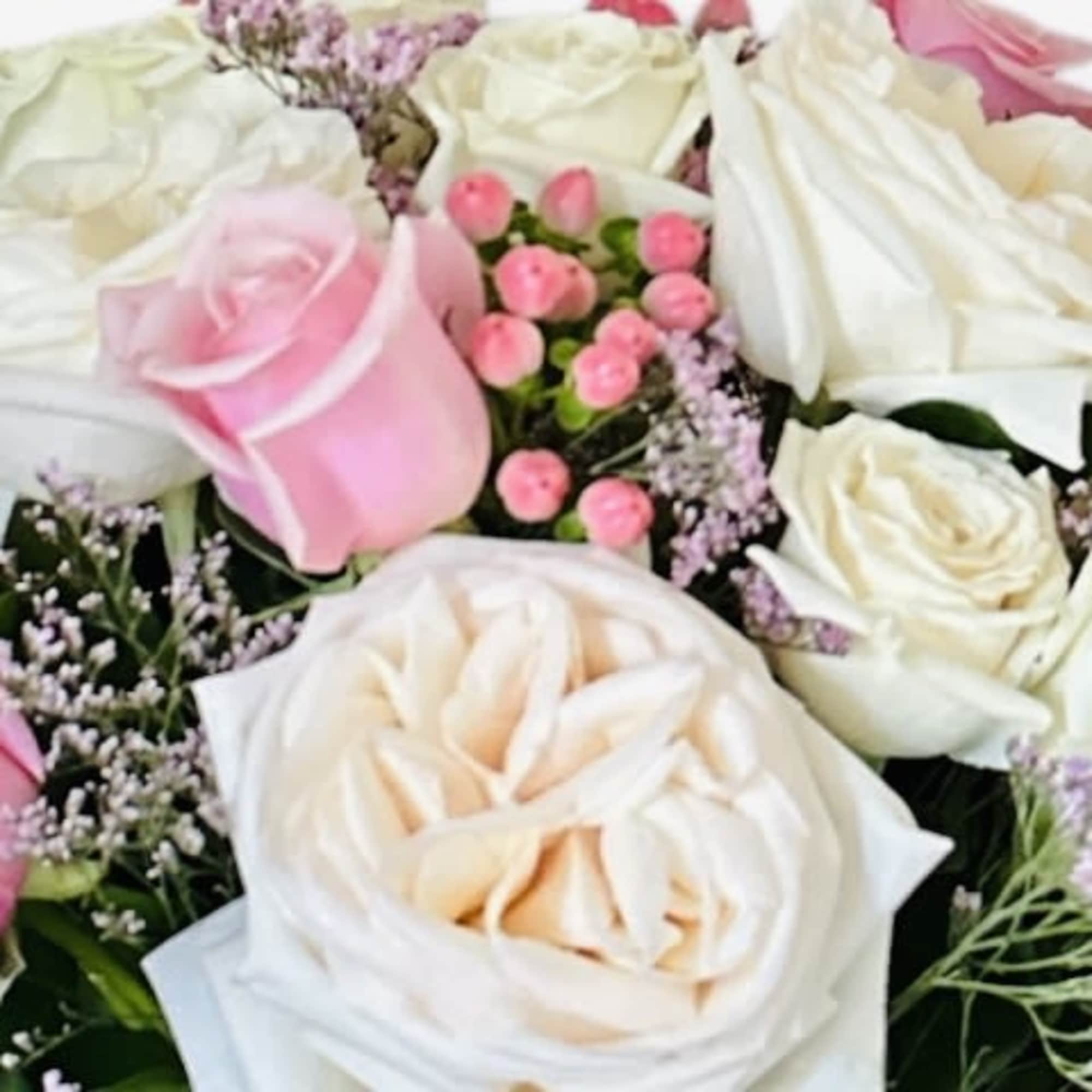 A cloud of blush-pink and ivory garden roses, accented with soft peach