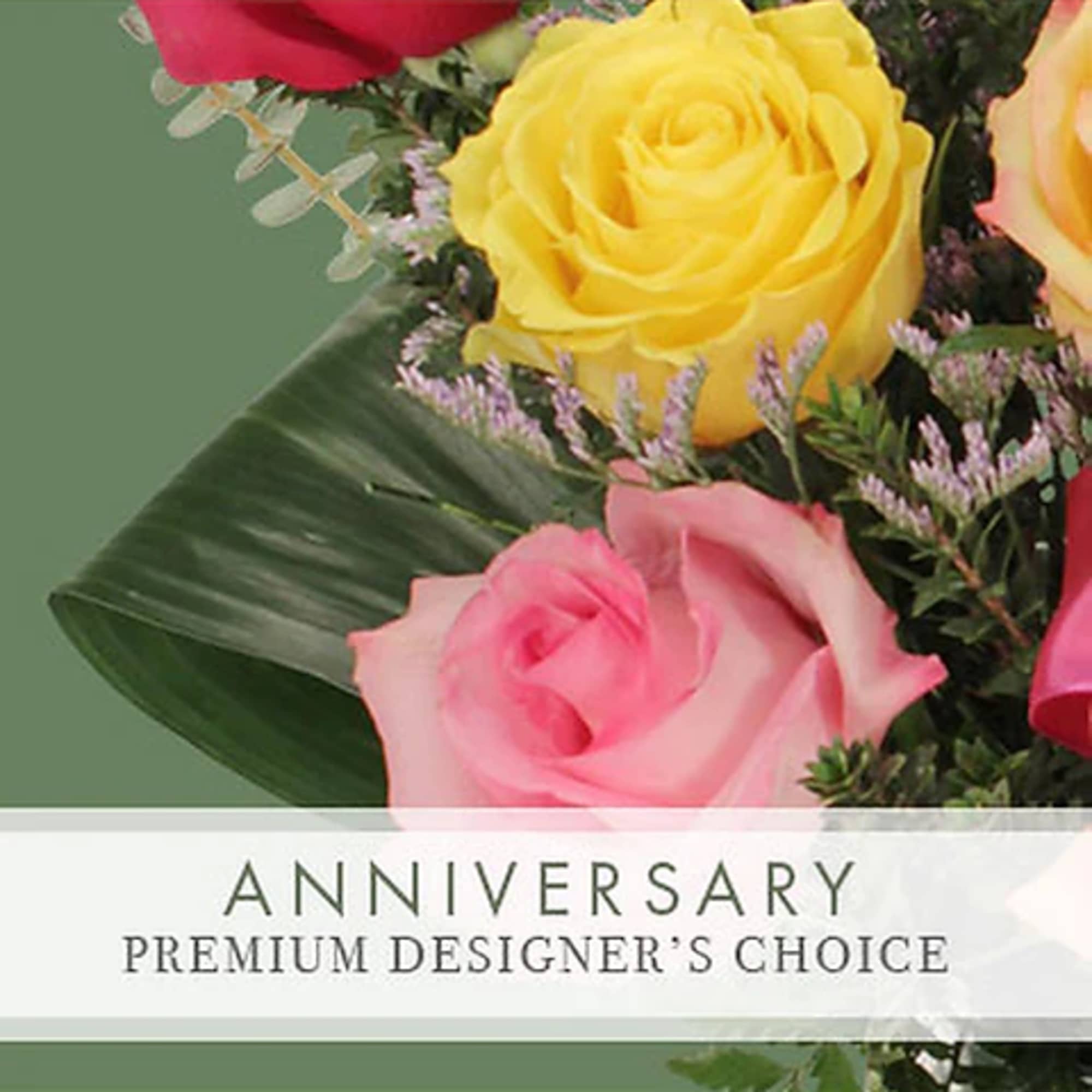 Bouquet of yellow and pink roses with greenery