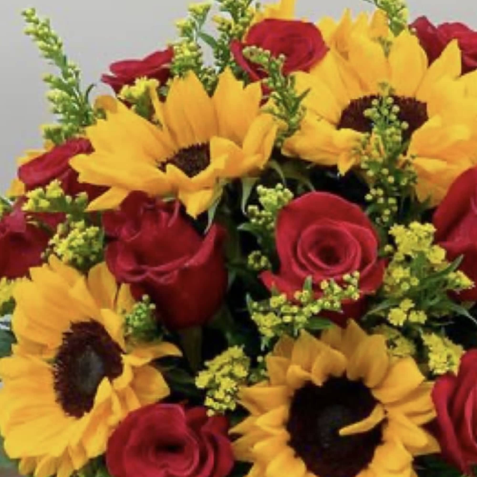 Bouquet of red roses and yellow sunflowers