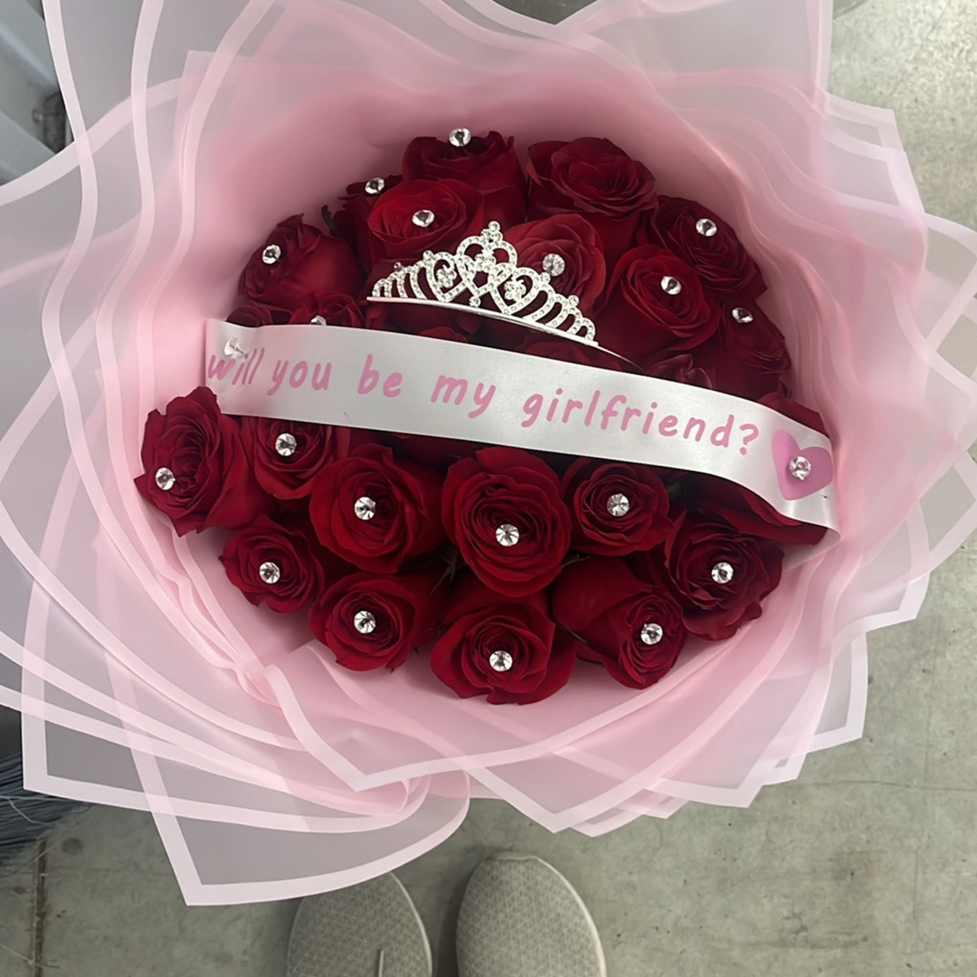 25 Red roses with pins and a message asking &ldquo; will you