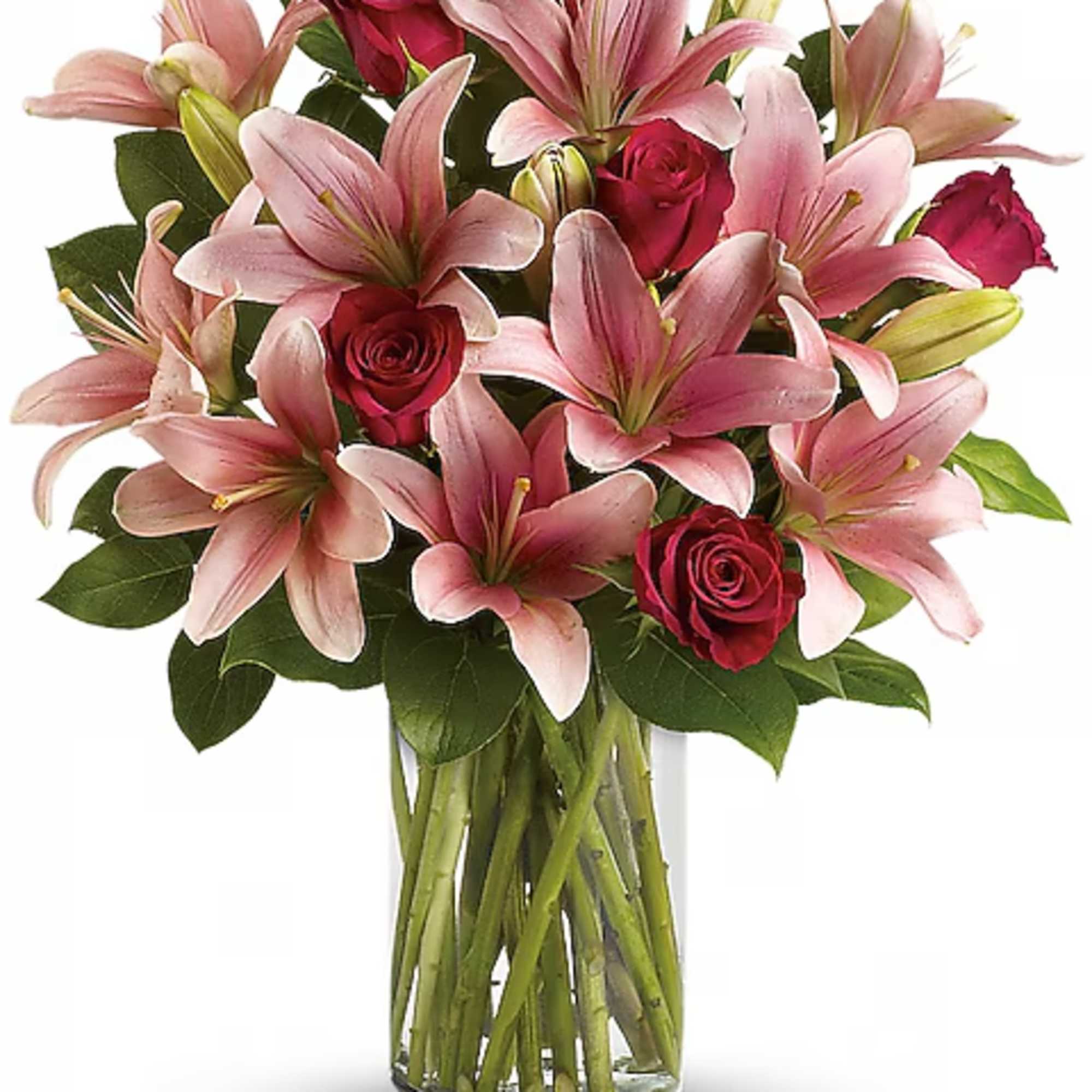 Pink lilies and red roses in a clear glass vase
