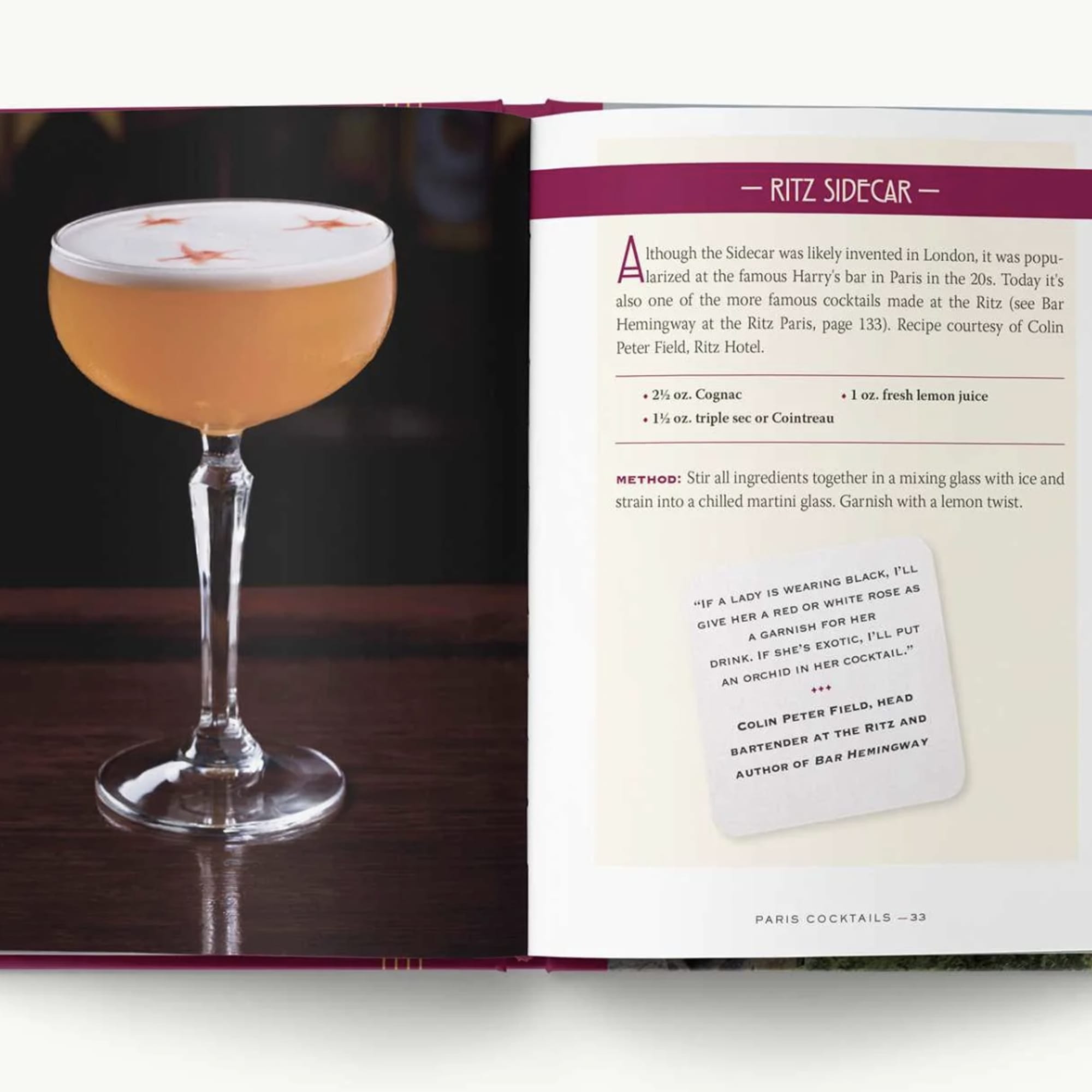 Cocktail in a stemmed coupe glass beside an open recipe book