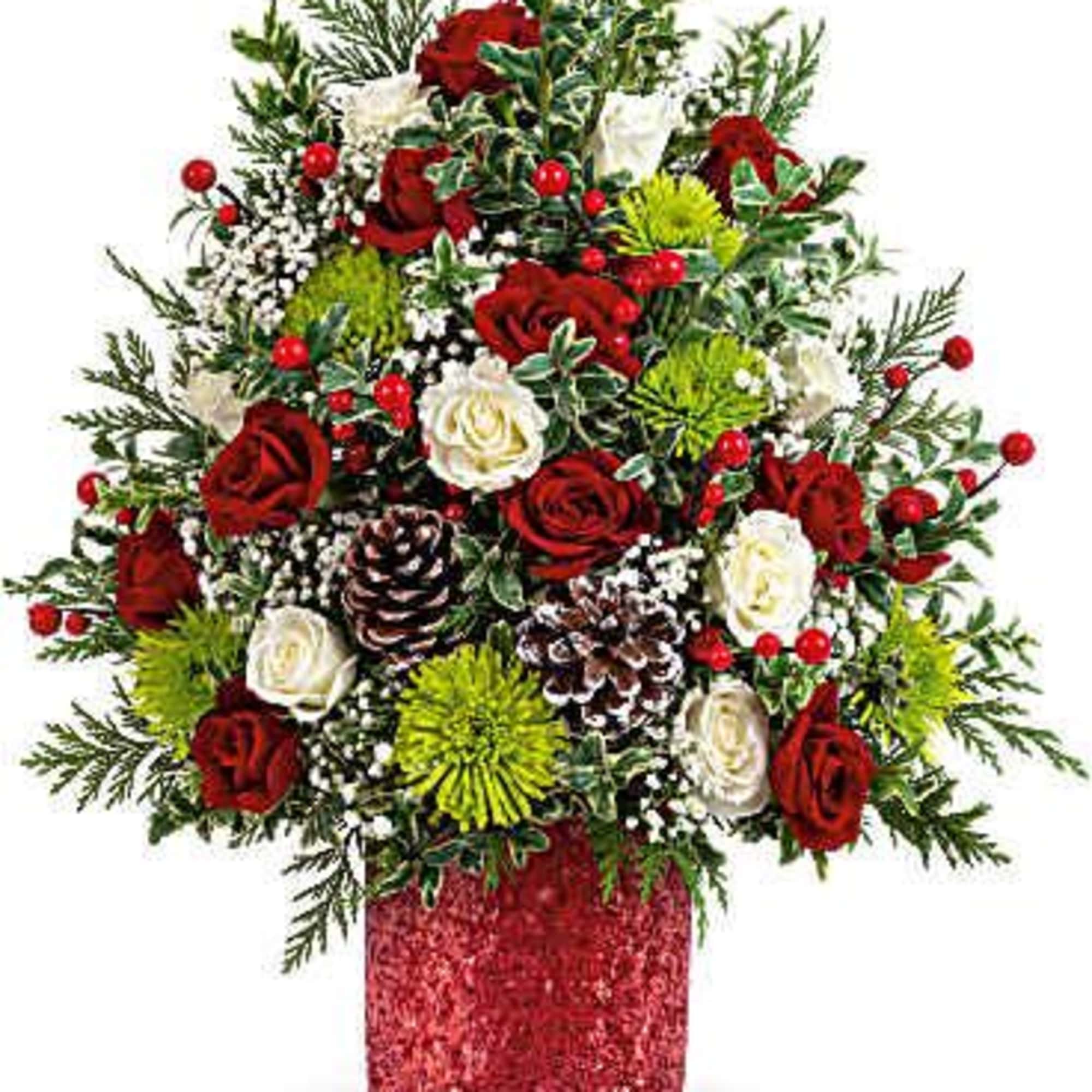Red and white roses with green accents in a red vase