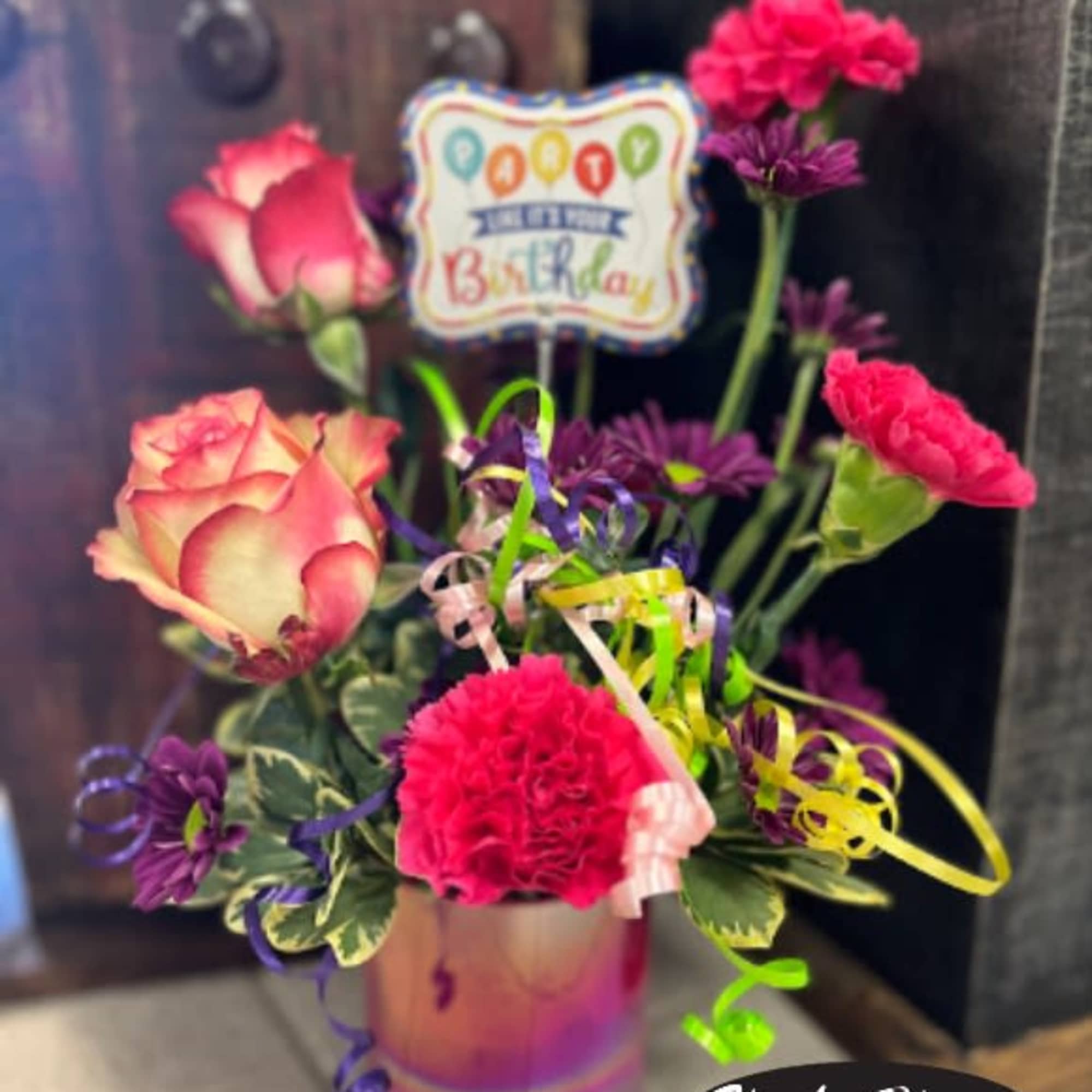 Birthday bouquet with pink roses and carnations in a vase