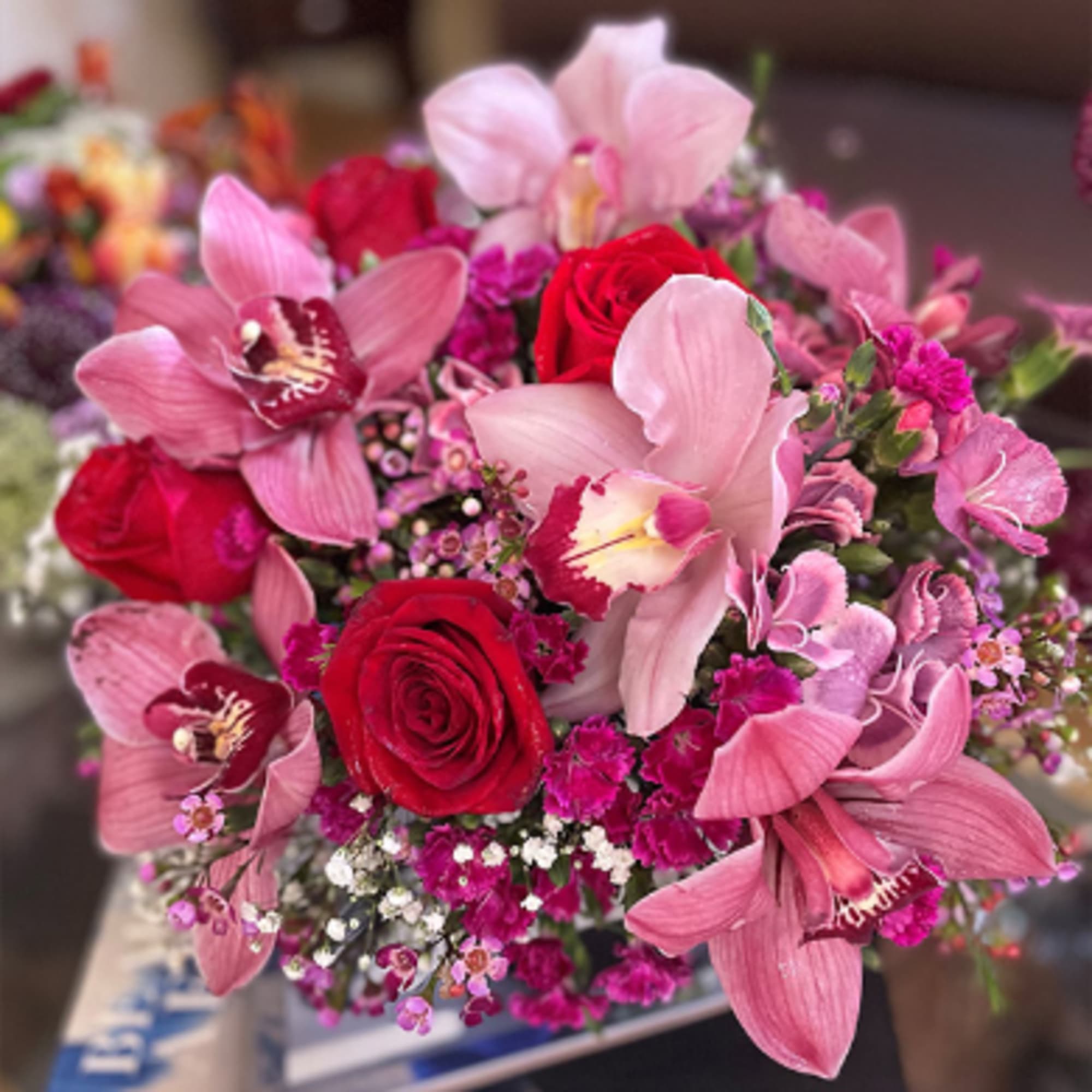 Bouquet of pink orchids and red roses
