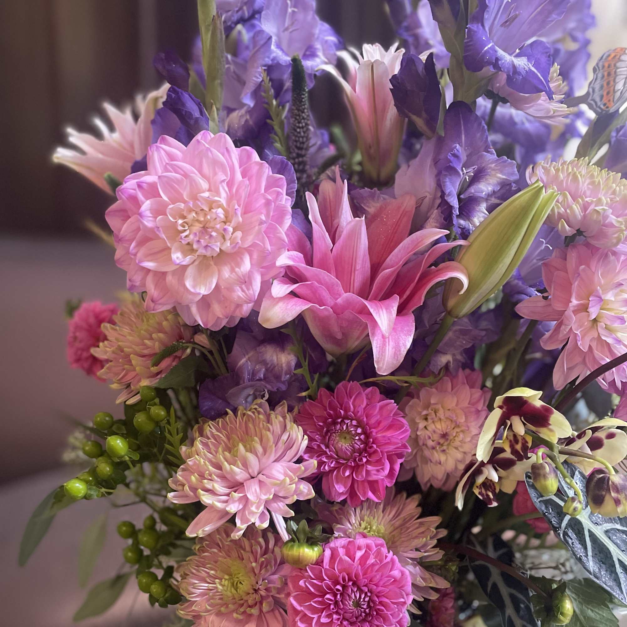Bouquet of pink and purple flowers with a few lily blooms