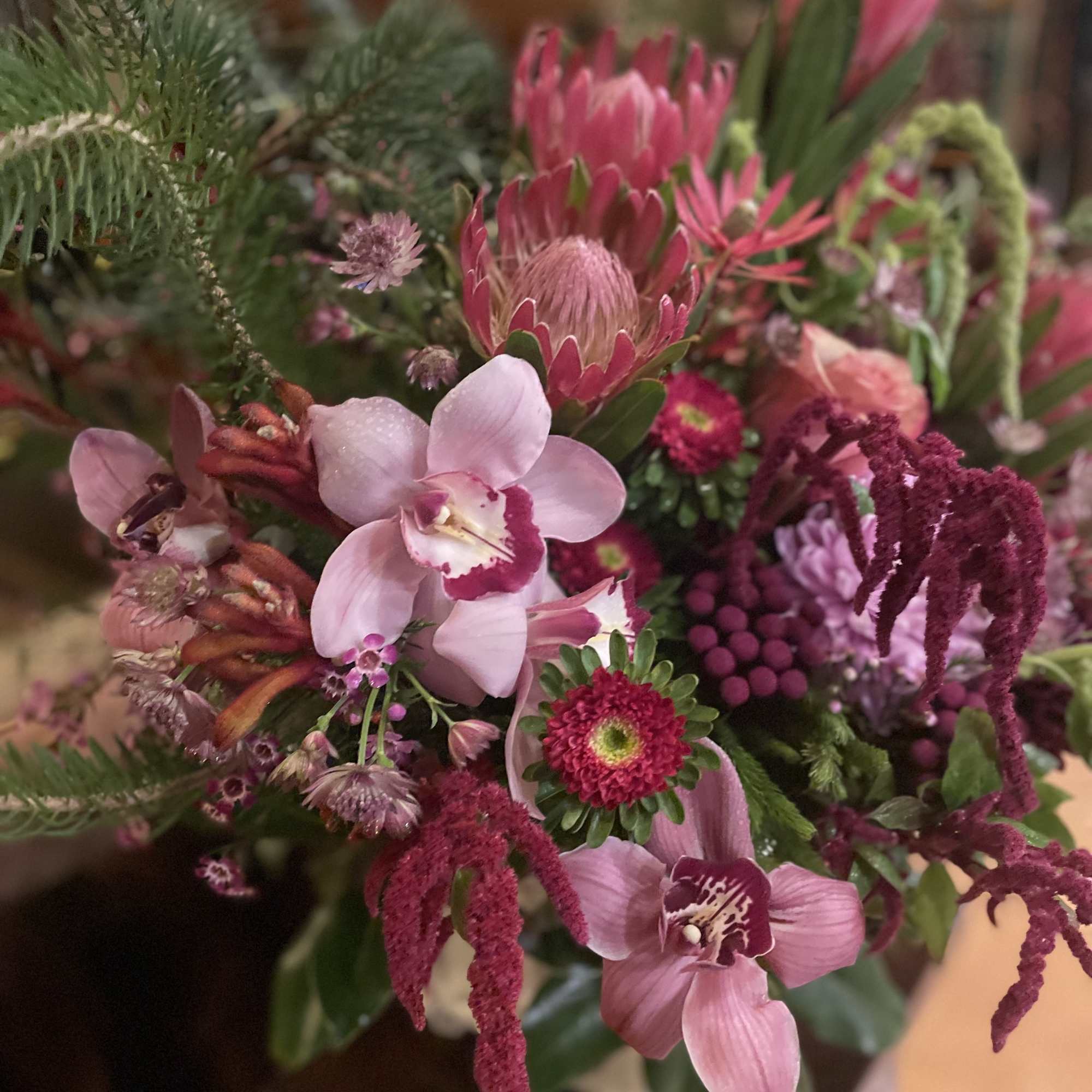 Pink orchid bouquet with magenta and green mixed blooms