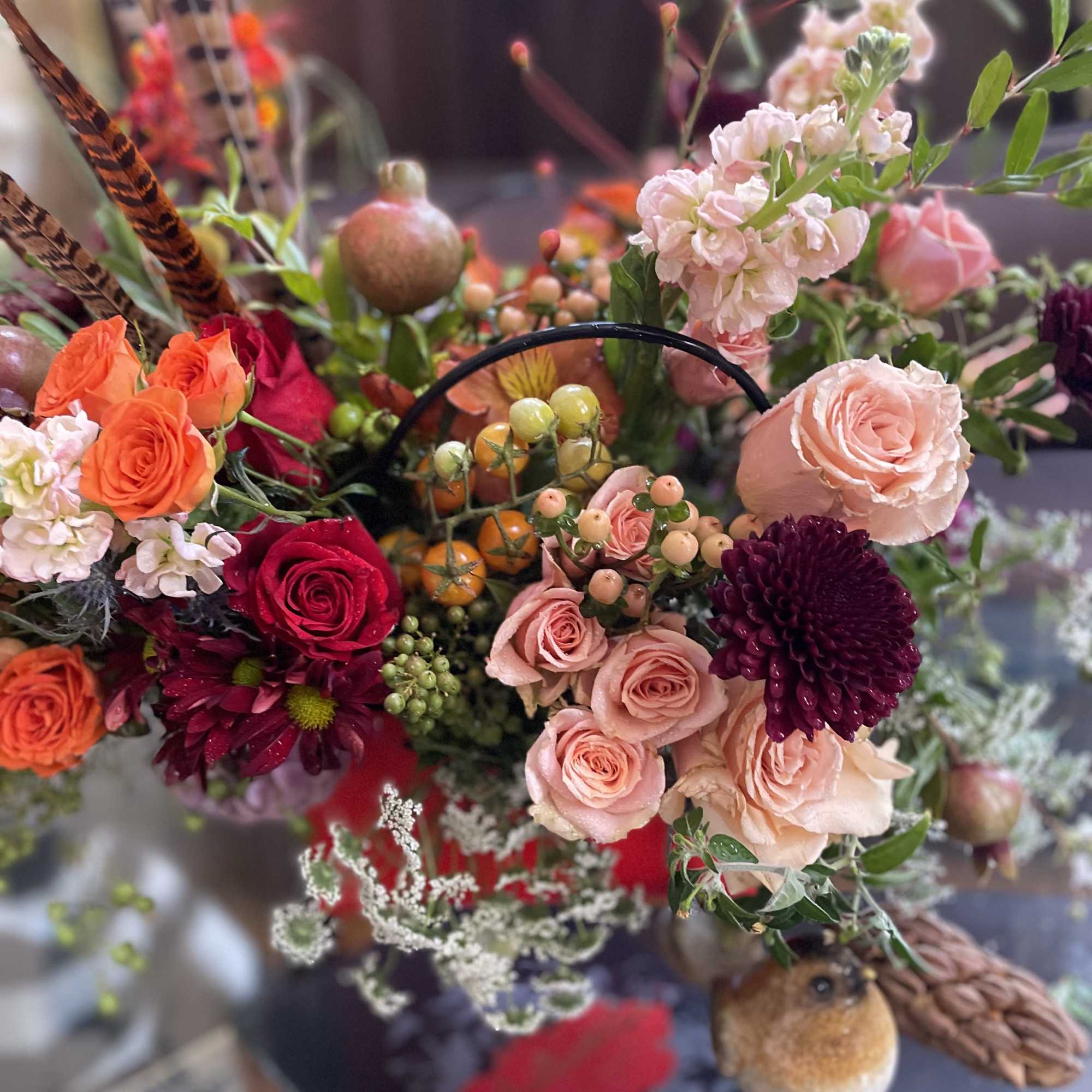 Mixed bouquet with pink, orange, and burgundy roses and chrysanthemums