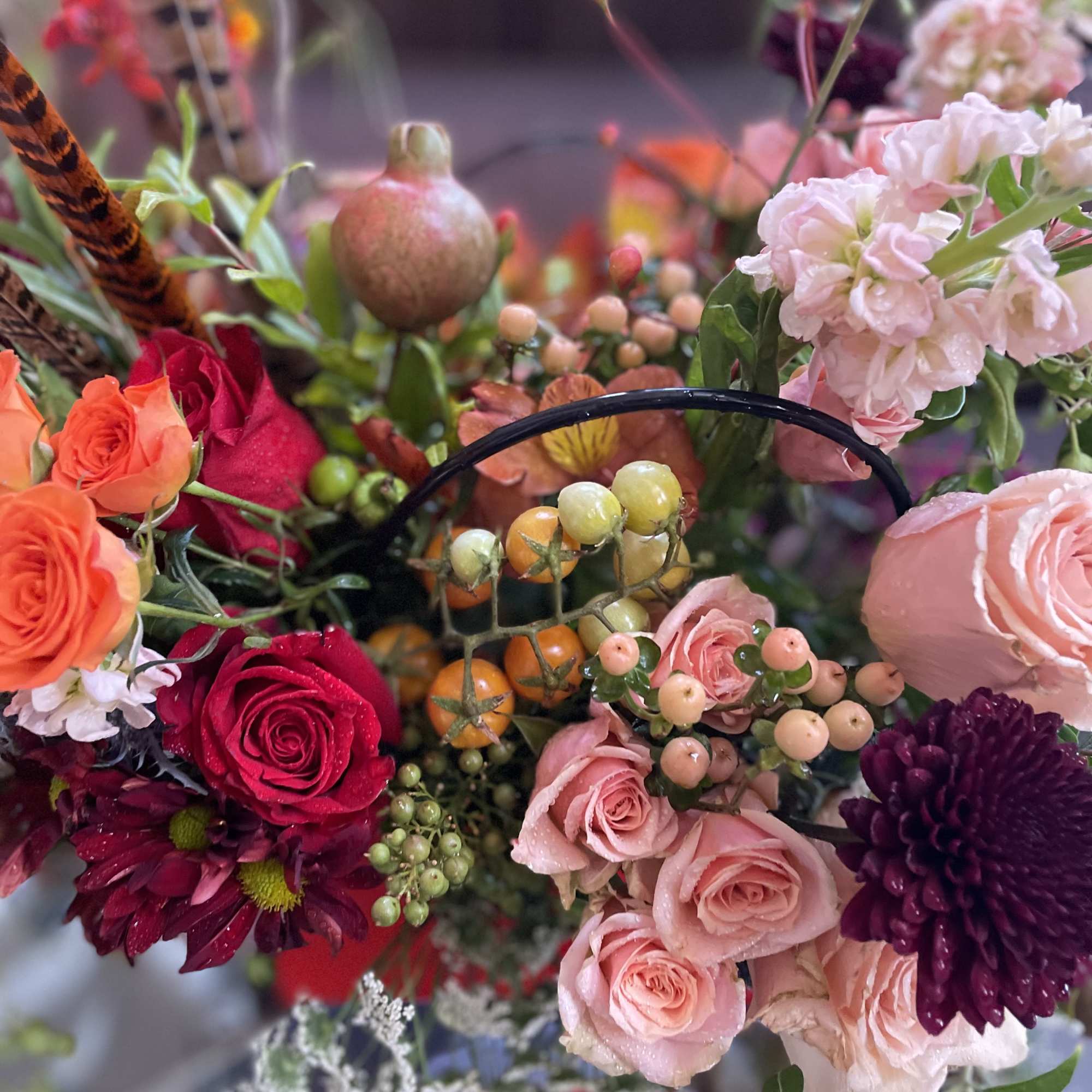 Mixed bouquet with pink, red, orange, and purple flowers