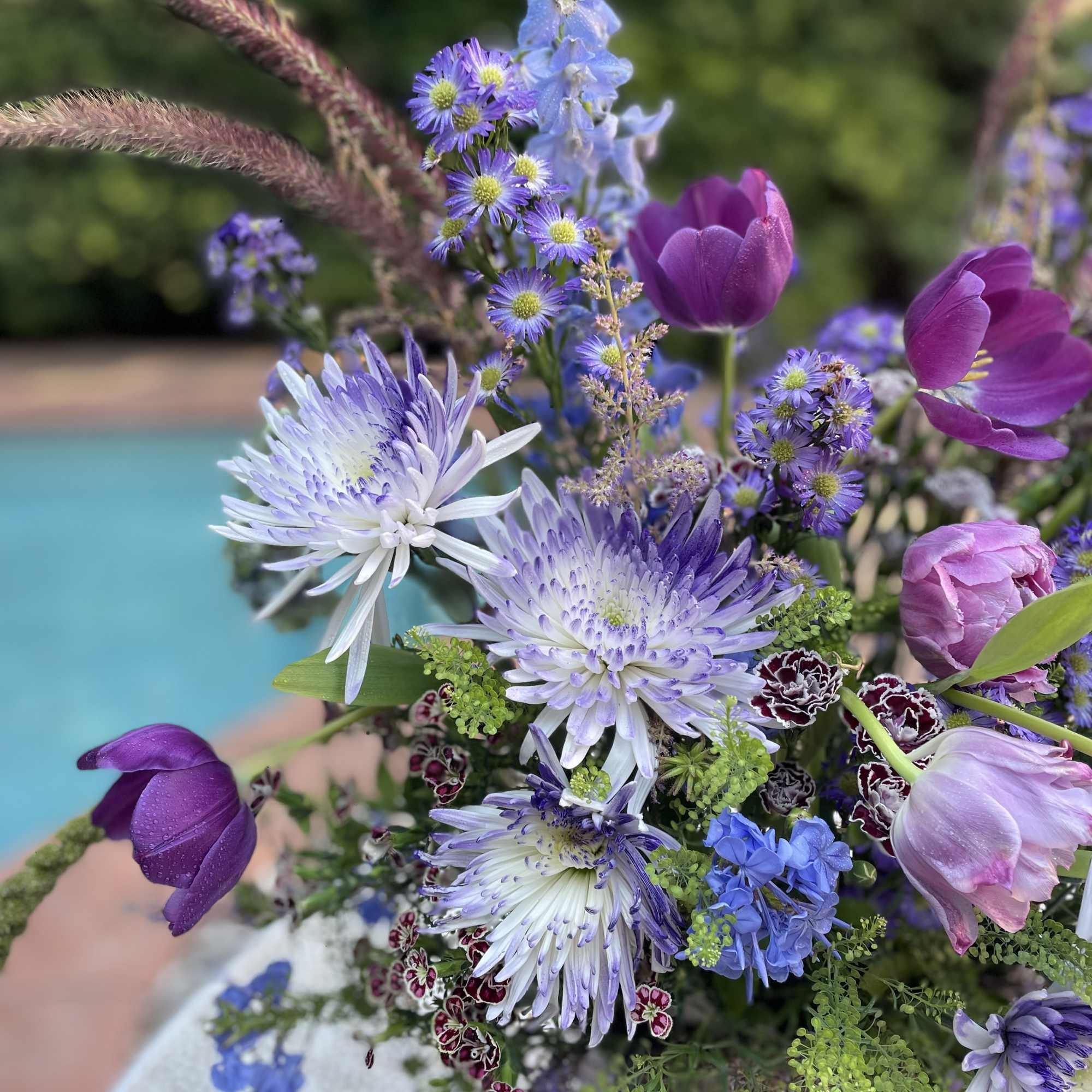 Purple and blue mixed bouquet with tulips and daisy-like blooms