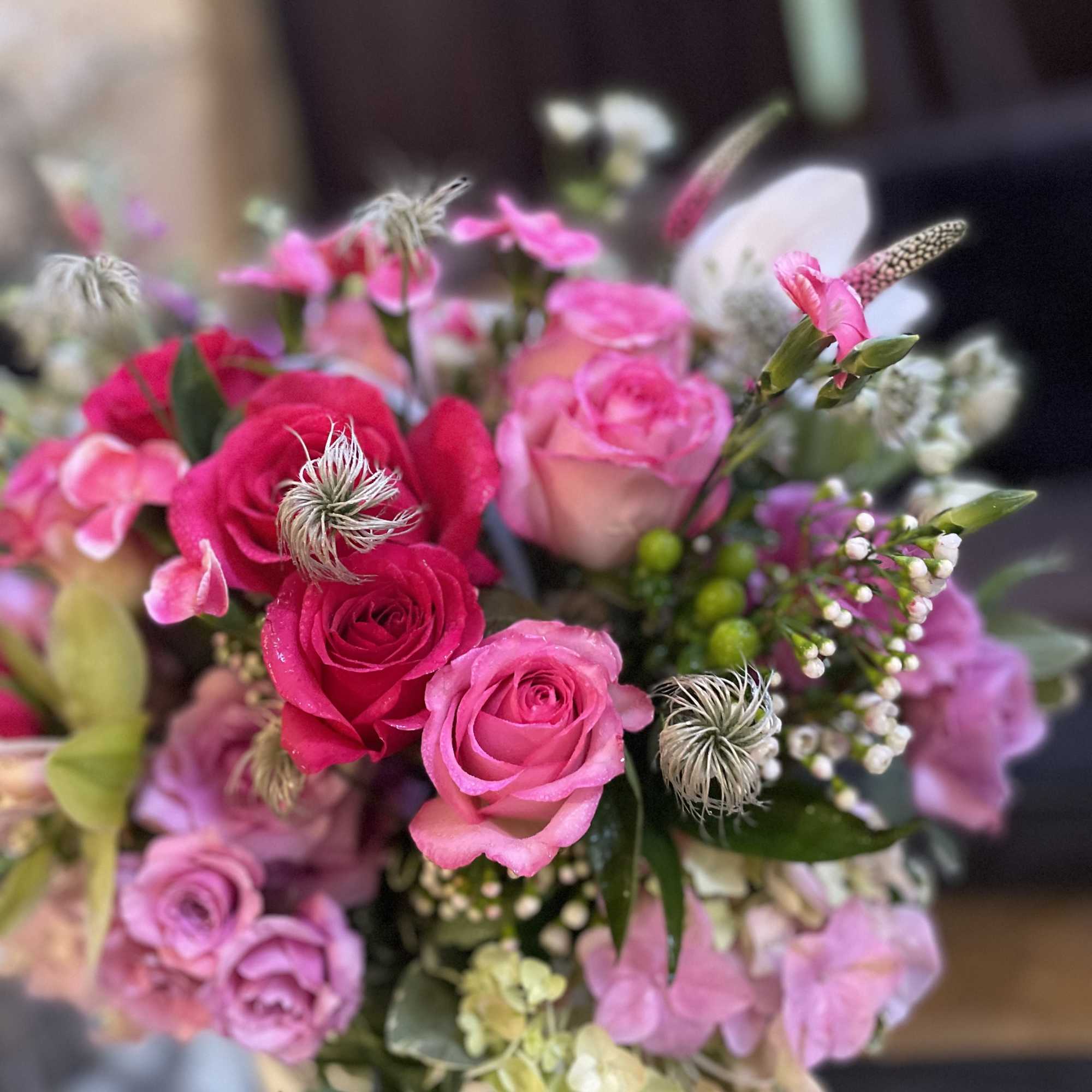 Bouquet of pink and red roses with mixed blooms