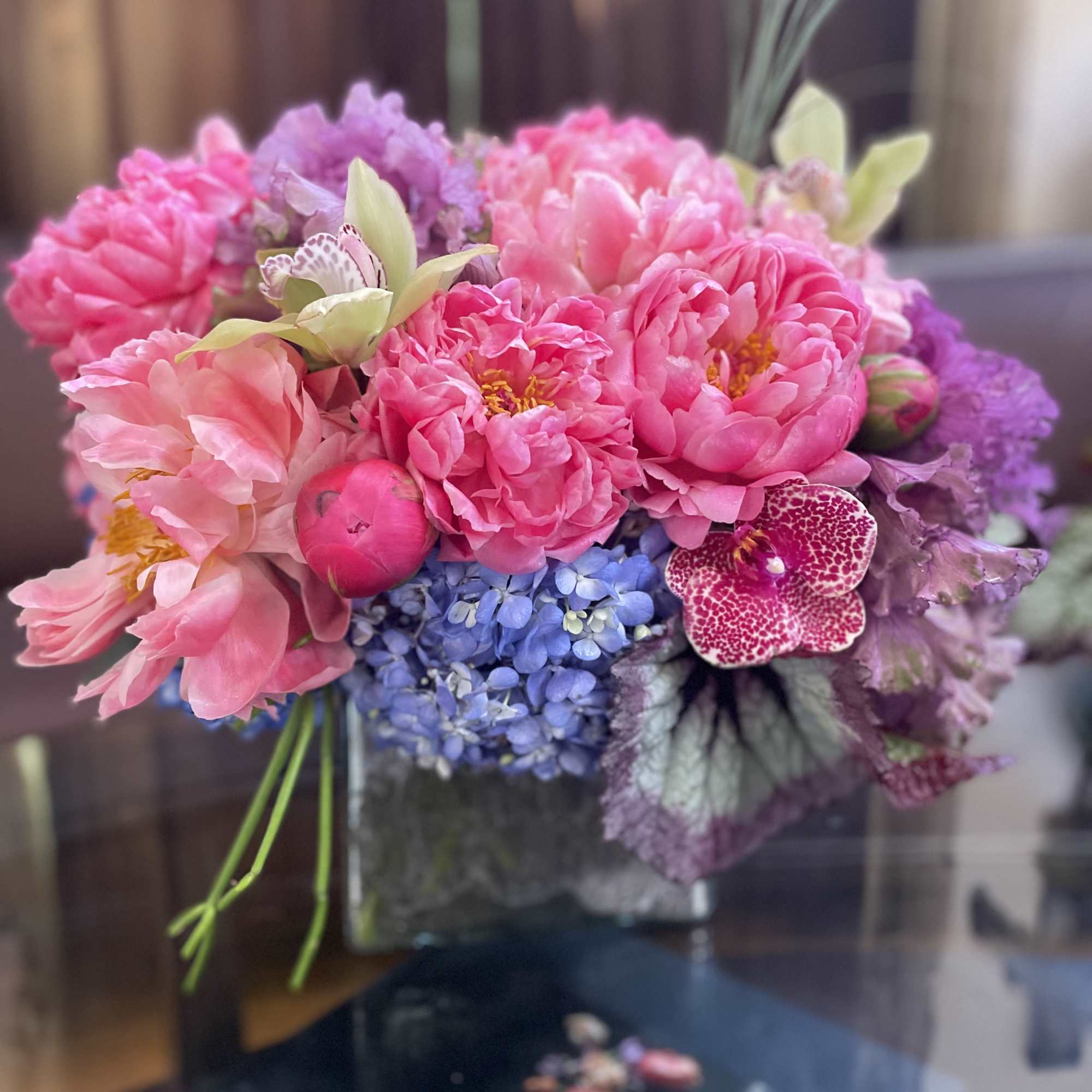 Pink and purple bouquet in a glass vase