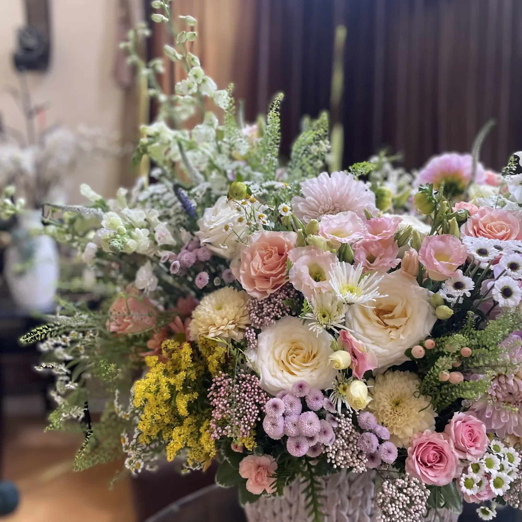 Large pastel flower arrangement in a woven basket, photo 7 of 7