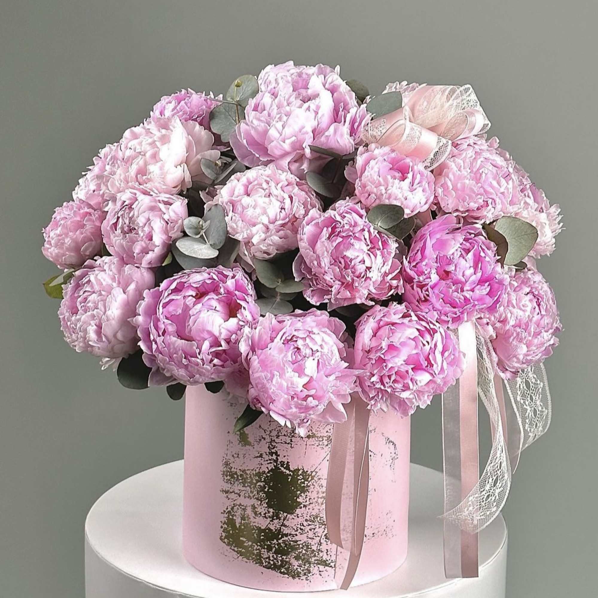 Pink peony bouquet in a pastel pink box with ribbon