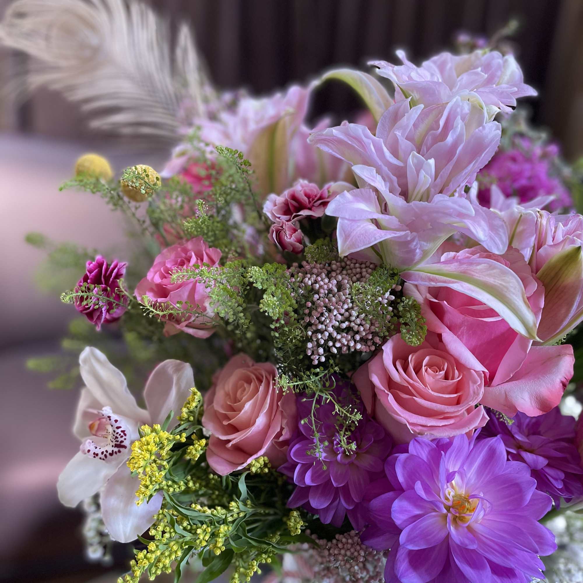Pink and purple mixed bouquet with roses and orchids