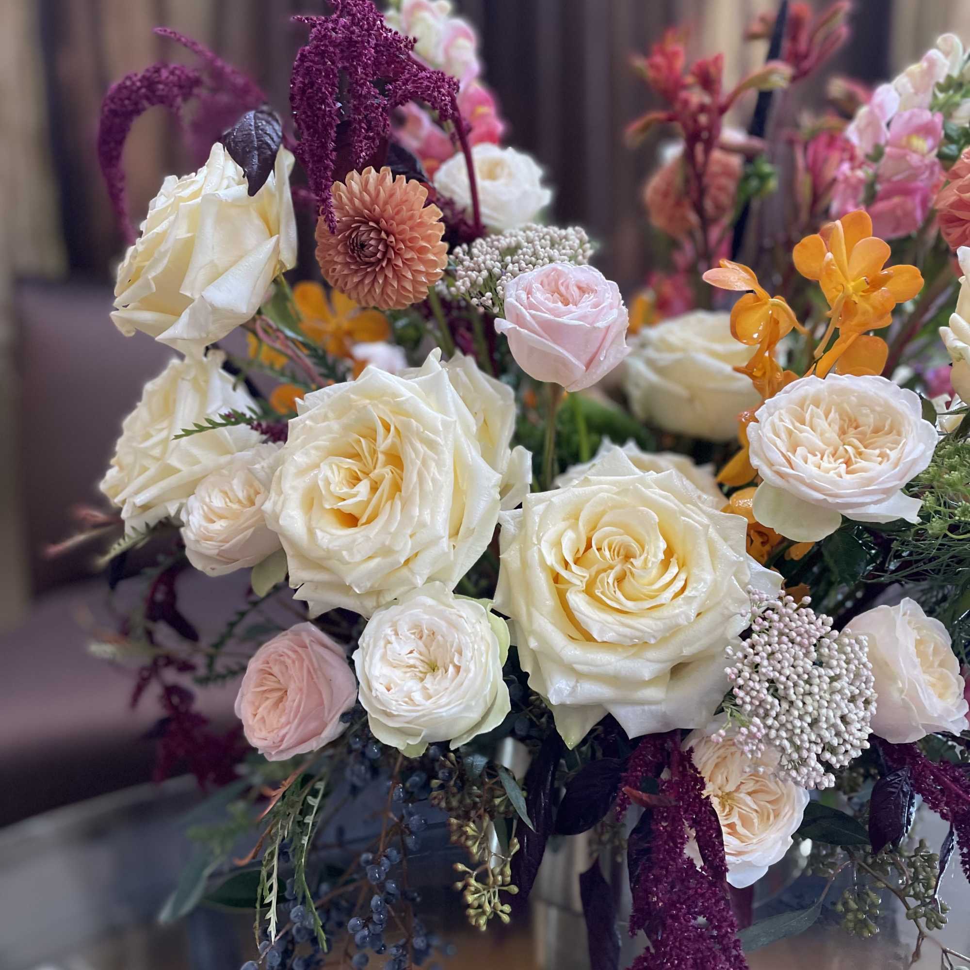 Bouquet of cream roses with pink and orange accent flowers