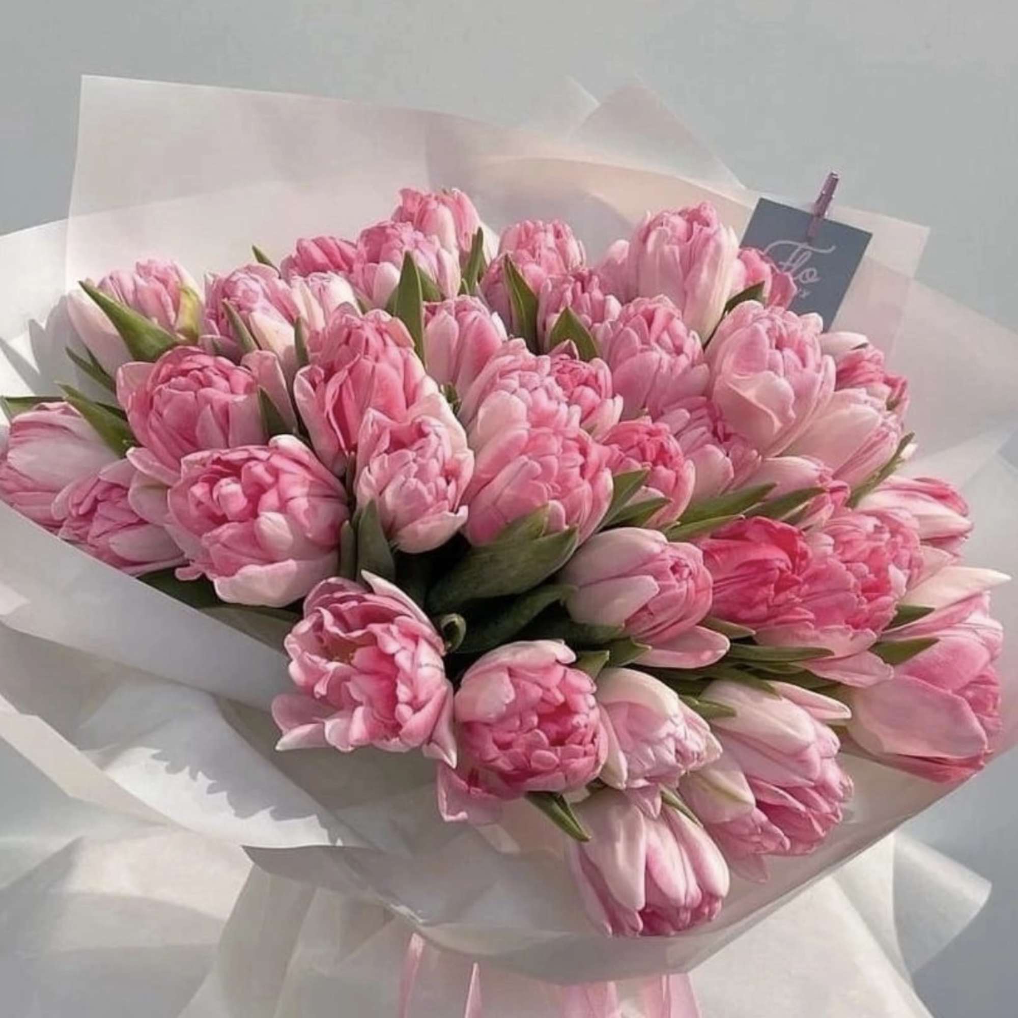 Bouquet of pink tulips wrapped in white paper, photo 2 of 4